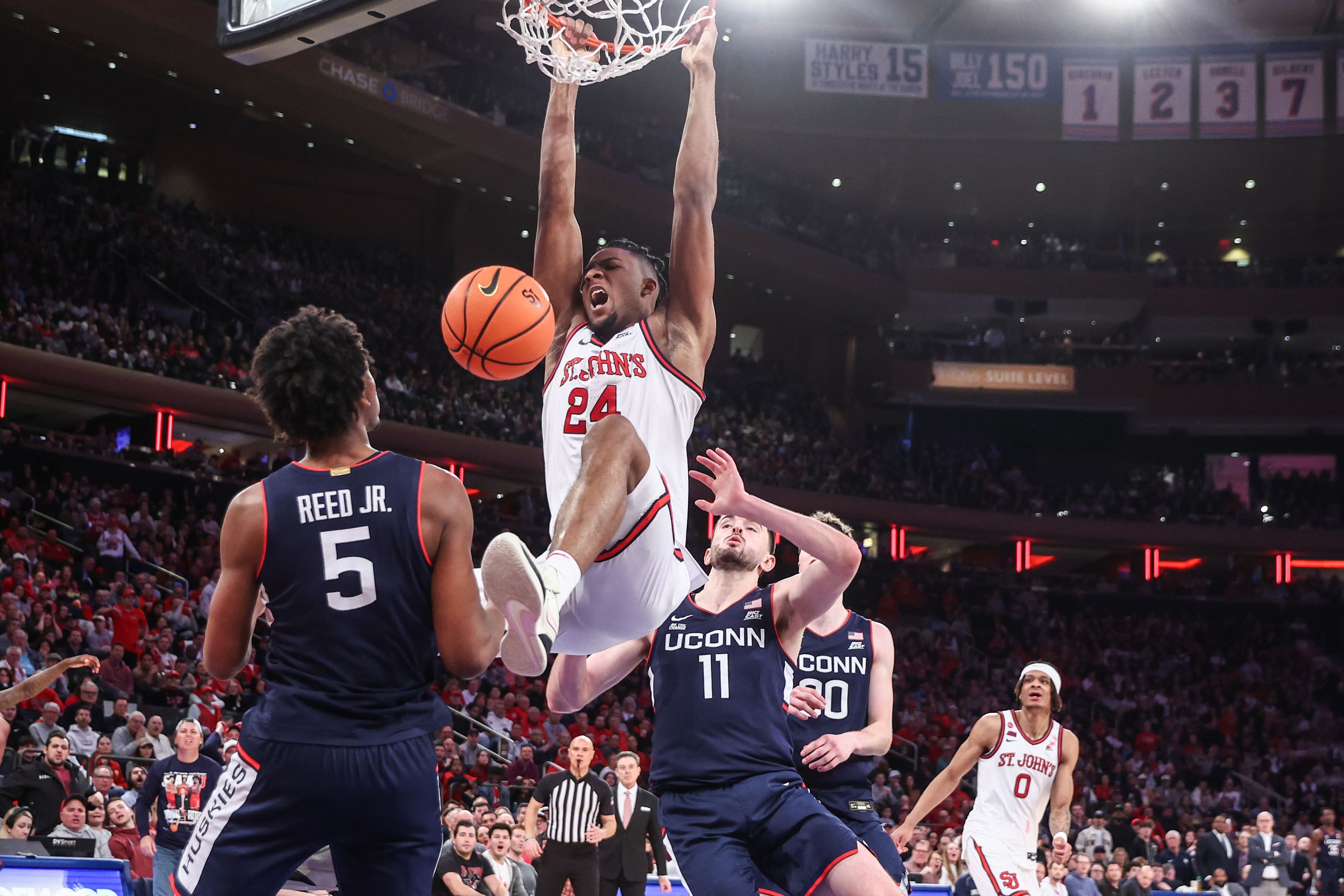 St. John&#039;s Red Storm forward Zuby Ejiofor (24) dunks past UConn Huskies forward Alex Karaban (11) in the second half at Madison Square Garden. Photo: Imagn