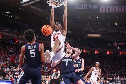 St. John's Red Storm forward Zuby Ejiofor (24) dunks past UConn Huskies forward Alex Karaban (11) in the second half at Madison Square Garden. Photo: Imagn