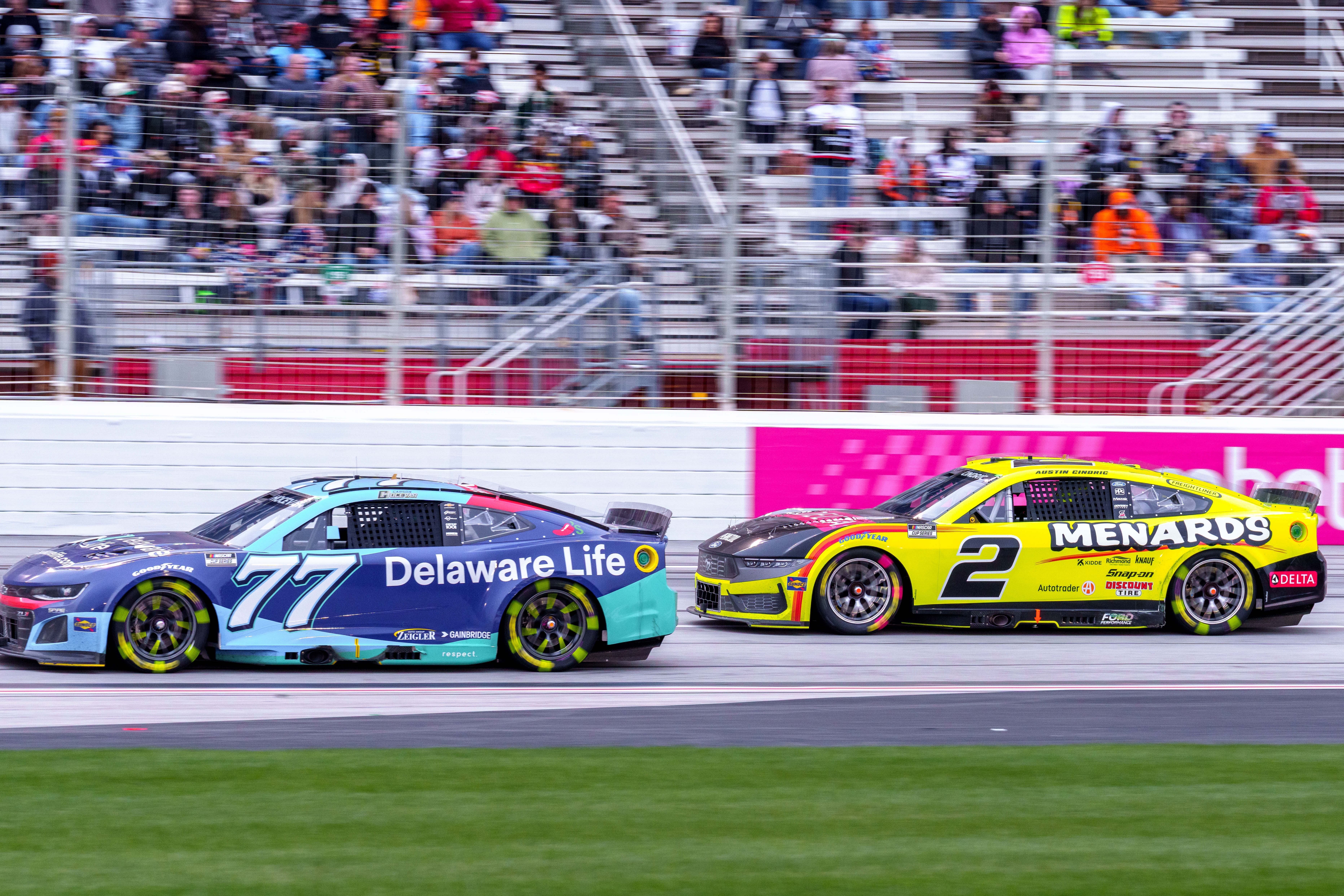 Carson Hocevar (77) and Austin Cindric (2) fight for position going into turn one at Atlanta Motor Speedway - Source: Imagn