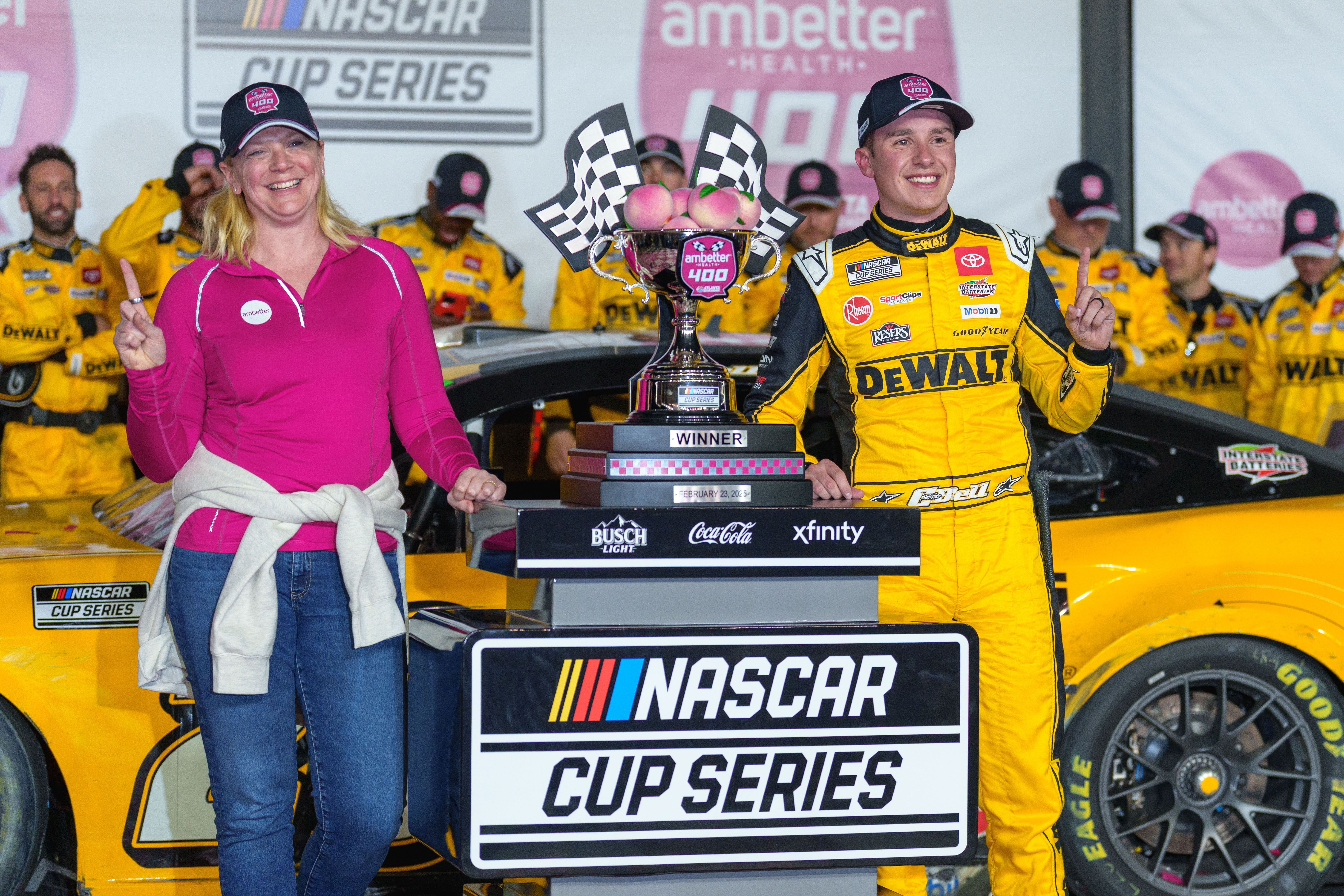 Christopher Bell (20) poses with his trophy in Victory Lane - Source: Imagn