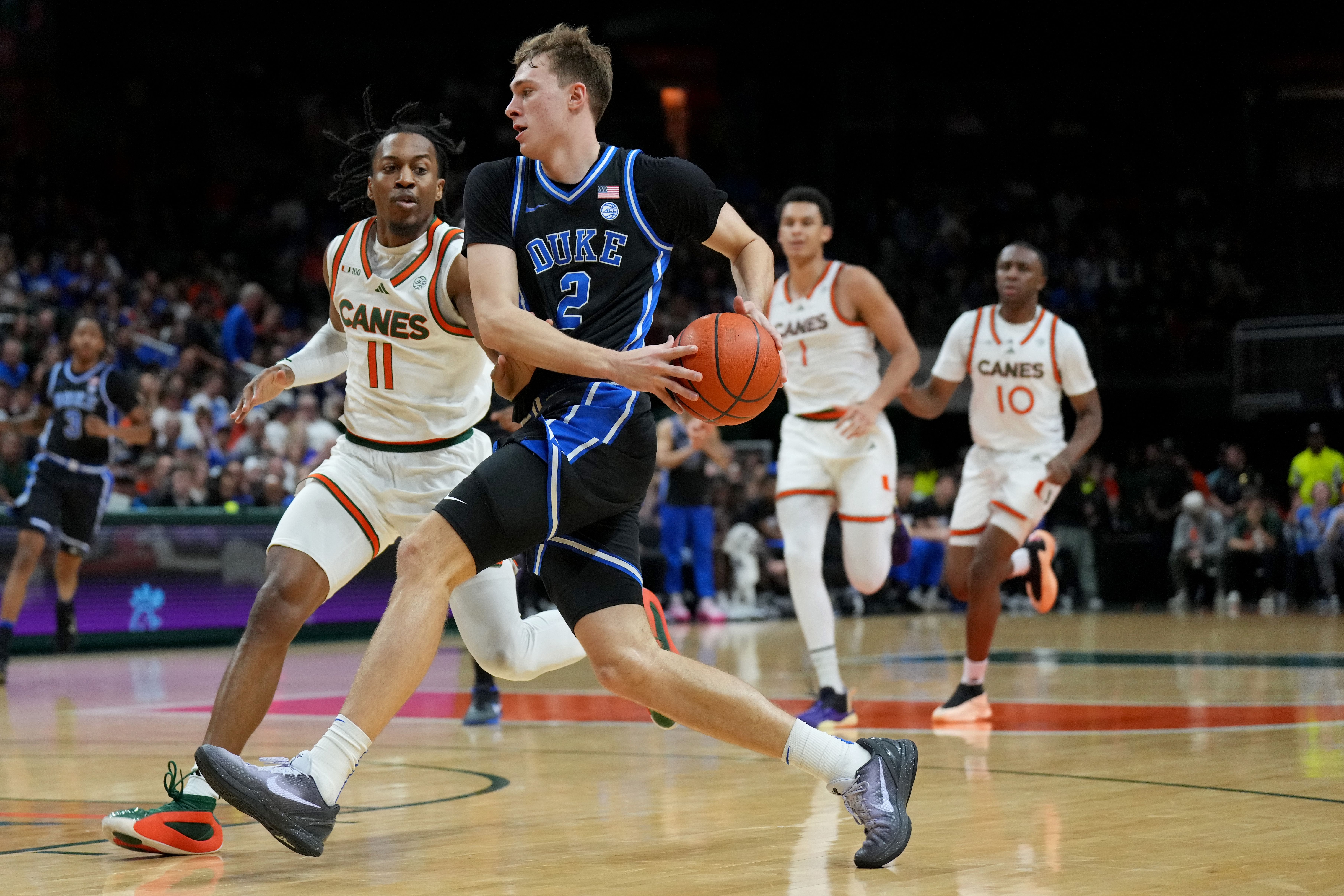 Duke Blue Devils guard Cooper Flagg (#2) drives to the basket as Miami Hurricanes guard A.J. Staton-McCray (#11) defends during the first half at Watsco Center. Photo: Imagn