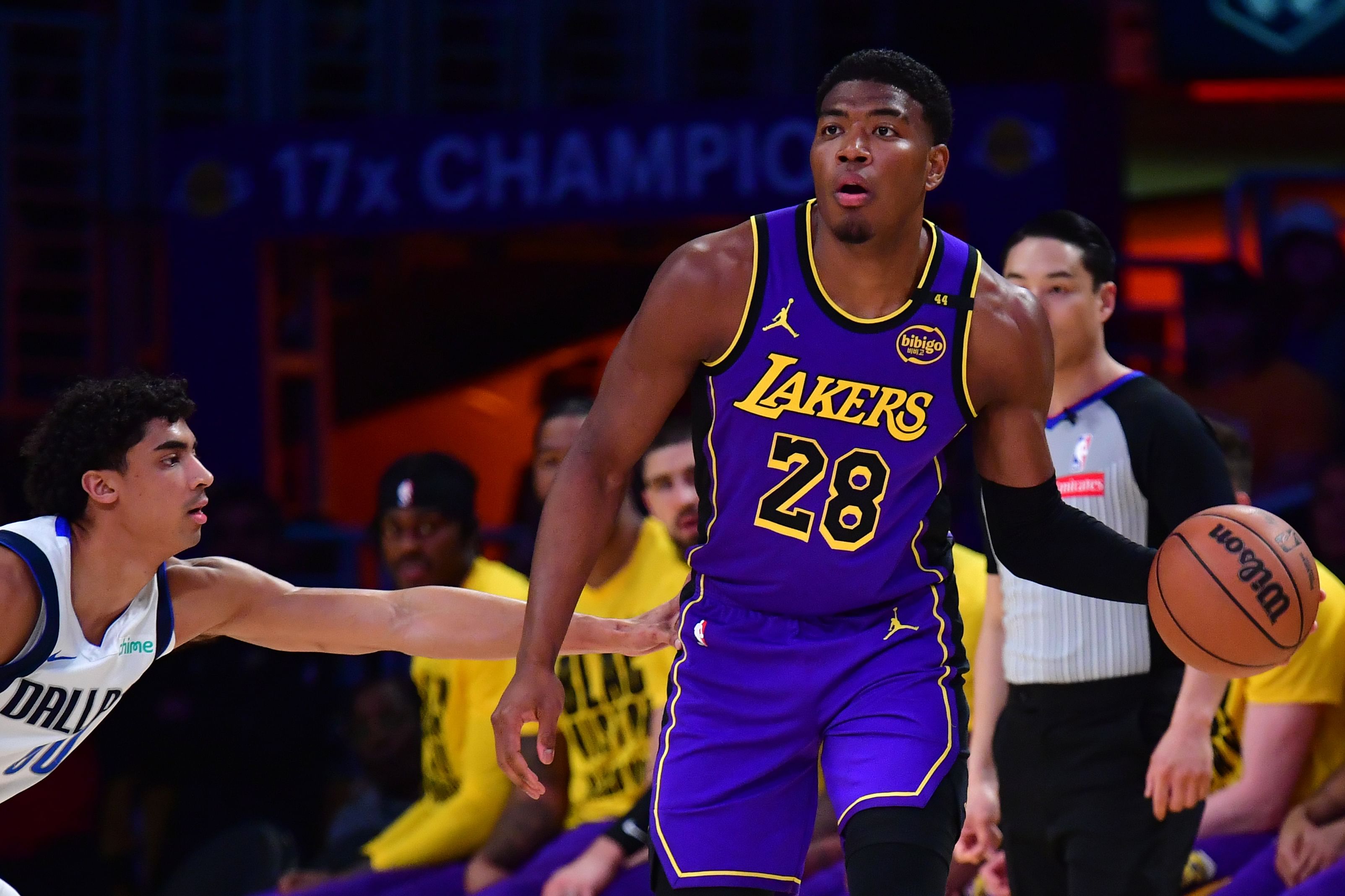 Los Angeles Lakers forward Rui Hachimura dribbles the ball on Dallas Mavericks guard Max Christie at Crypto.com Arena.