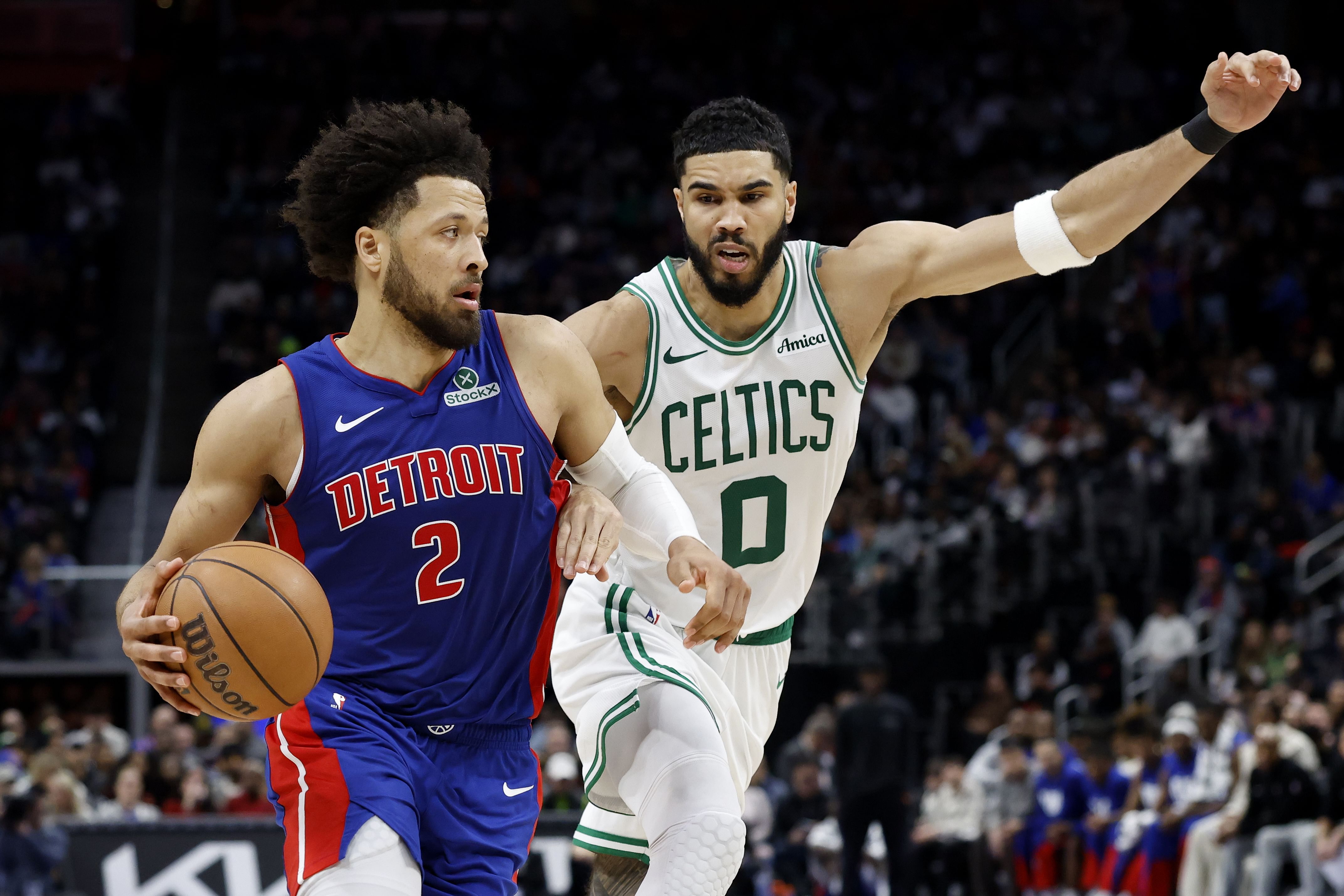 Feb 26, 2025; Detroit, Michigan, USA; Detroit Pistons guard Cade Cunningham (2) dribbles on Boston Celtics forward Jayson Tatum (0) in the second half at Little Caesars Arena. Mandatory Credit: Rick Osentoski-Imagn Images - Source: Imagn