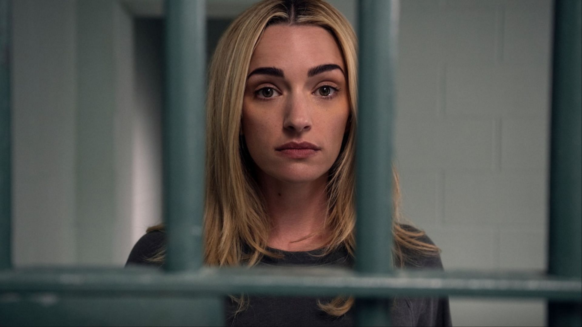 Georgia Miller, played by Brianne Howey, behind bars as her legal troubles take center stage in Ginny &amp; Georgia season 3. (Photo via Amanda Matlovich/Netflix Tudum)