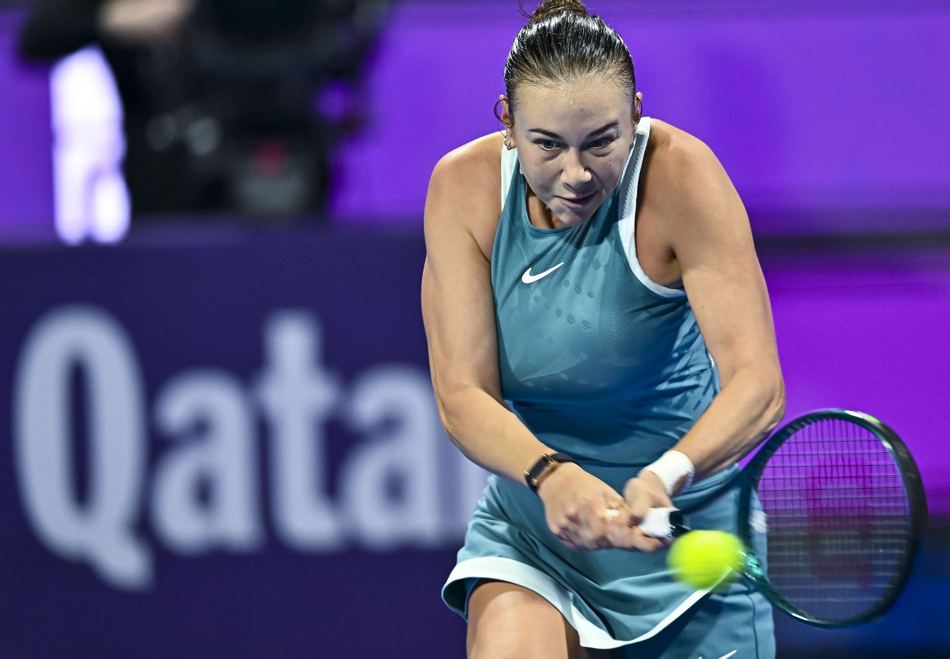 Anisimova plays a backhand in the Qatar Open - Day Seven - Source: Getty