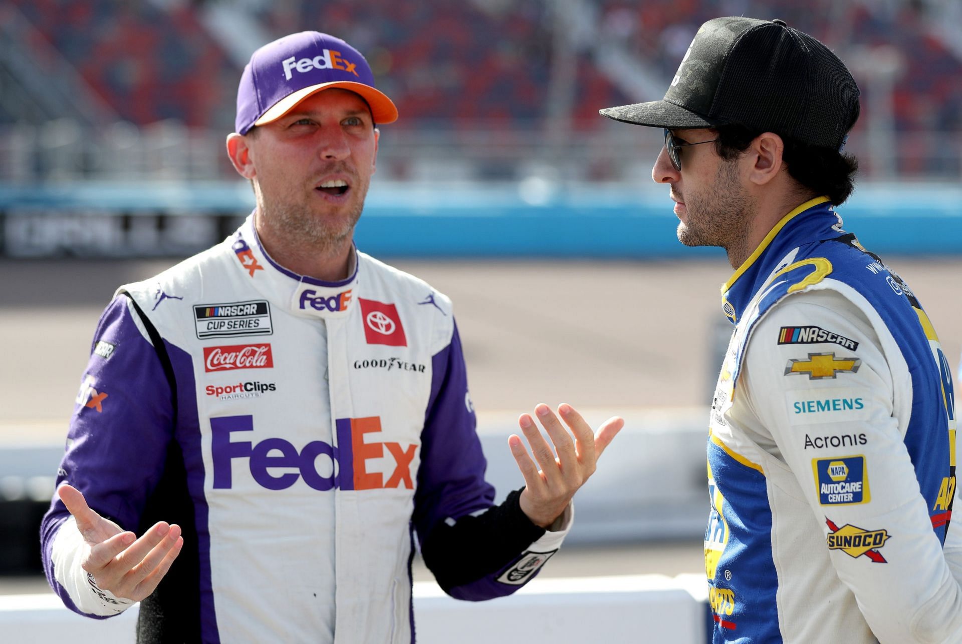 AVONDALE, ARIZONA - NOVEMBER 05: Chase Elliott, driver of the #9 NAPA Auto Parts Chevrolet, (R) and Denny Hamlin, driver of the #11 FedEx Express Toyota, talk on the grid during qualifying for the NASCAR Cup Series Championship at Phoenix Raceway on November 05, 2022 in Avondale, Arizona. (Photo by Meg Oliphant/Getty Images) - Source: Getty