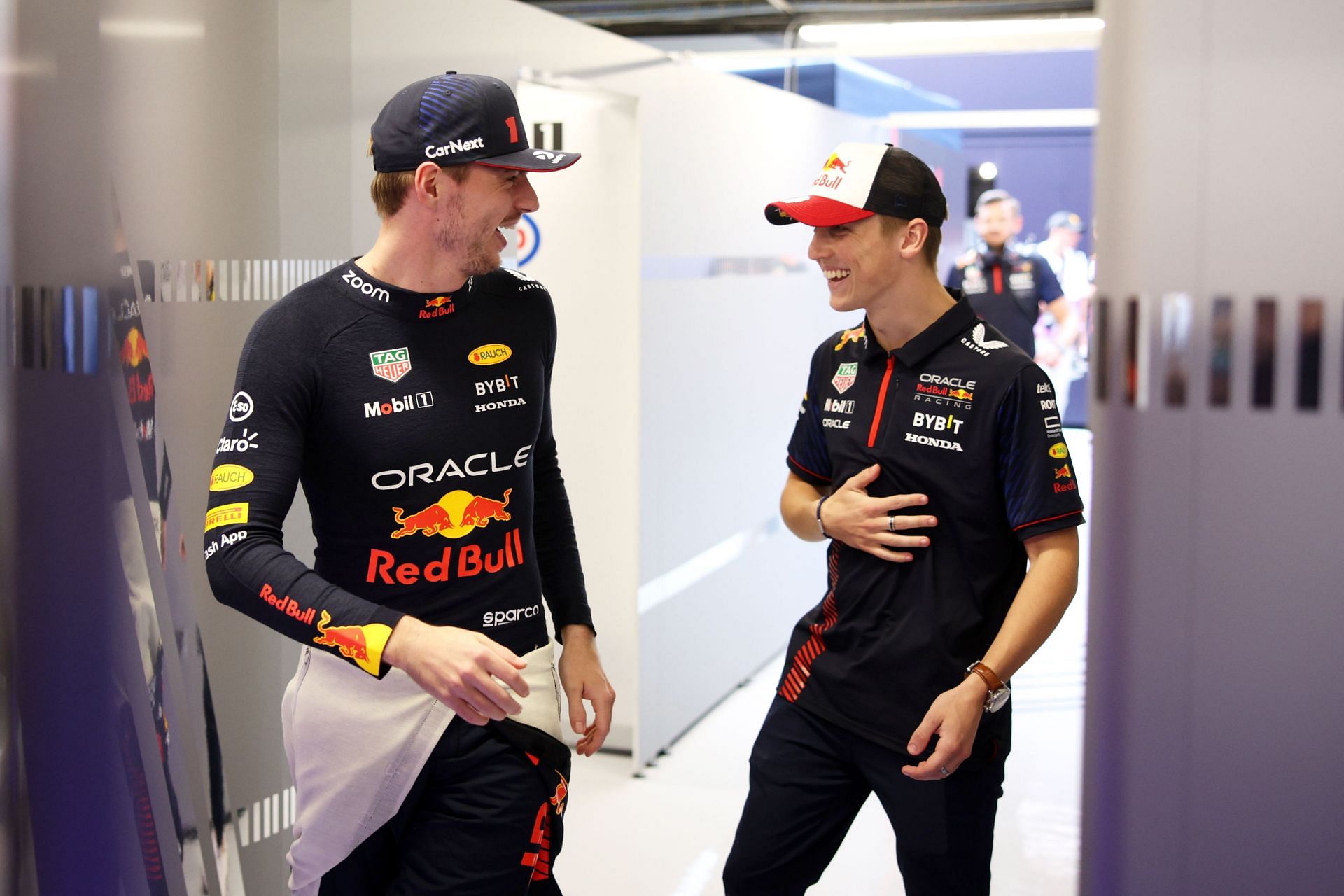 Max Verstappen of the Netherlands and Oracle Red Bull Racing talks with Liam Lawson of New Zealand and Oracle Red Bull Racing in the garage - Source: Getty