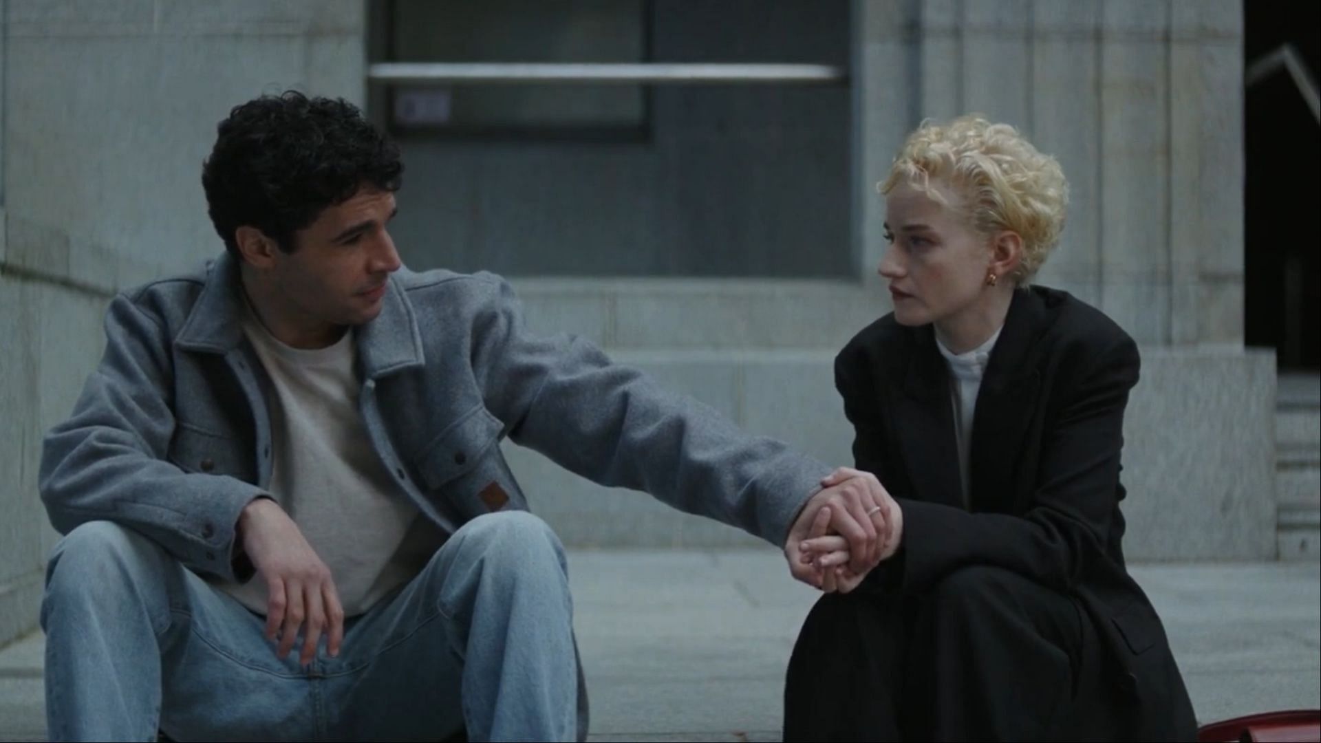 Christopher Abbott as Blake and Julia Garner as Charlotte share a tender yet emotional moment in the film. (Image via AppleTV+)