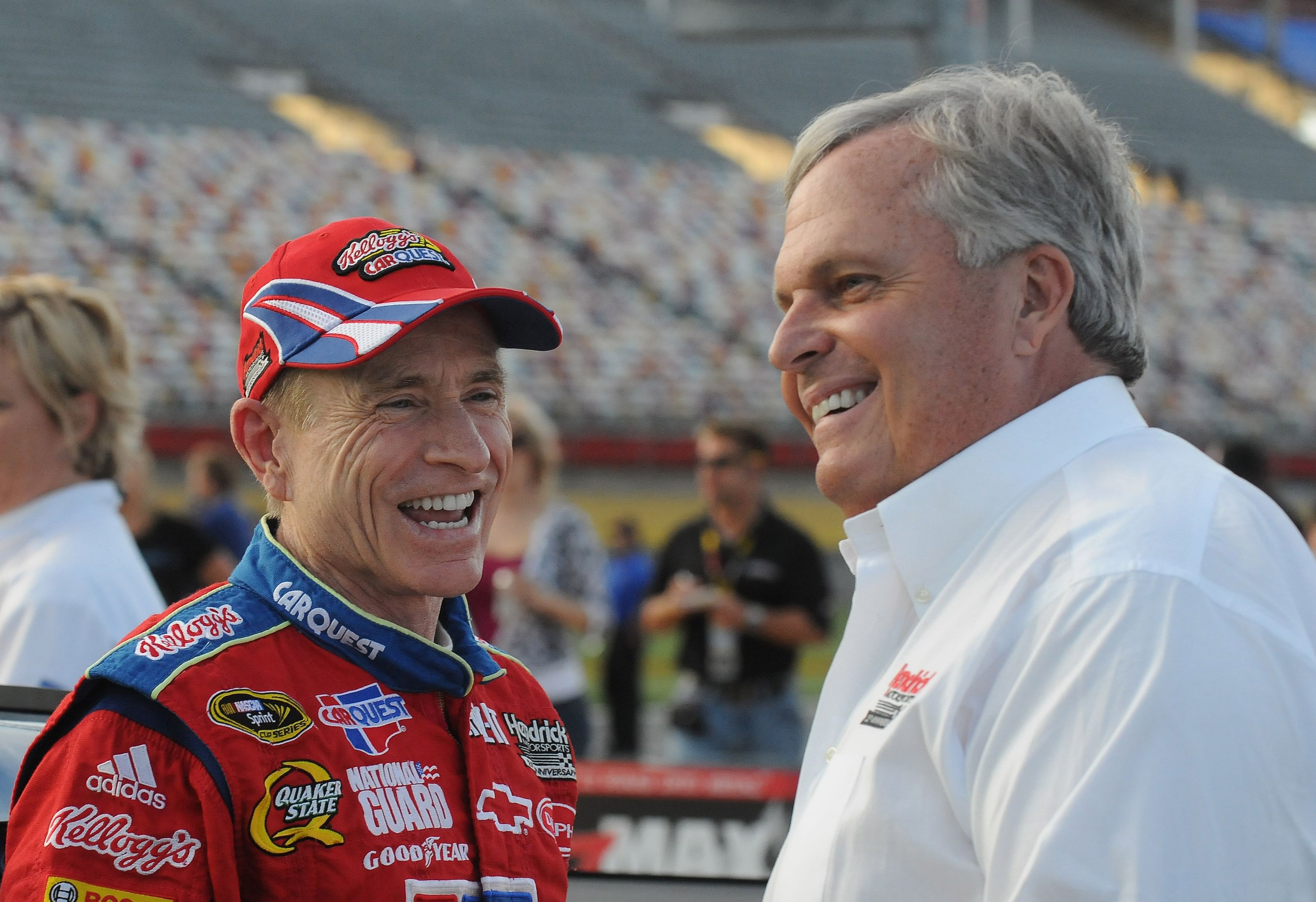 NASCAR Sprint Cup Series driver Mark Martin (left) talks with Hendrick Motorsports team owner Rick Hendrick - Source: Imagn