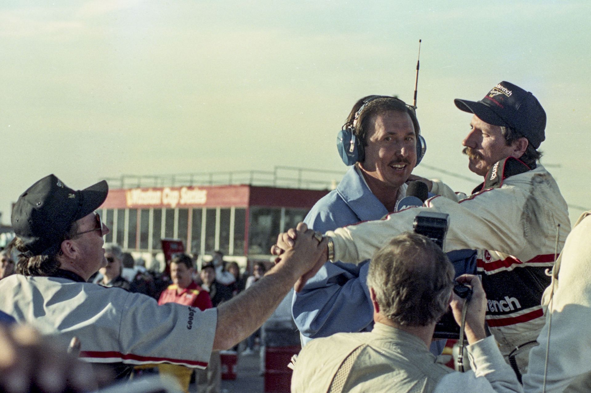 HAMPTON, GA - NOVEMBER 18: Dale Earnhardt , R, is congratulated by his car owner Richard Childress after winning his 4th NASCAR Winston Cup championship st the Atlanta Journal 500, NASCAR Winston Cup race, Atlanta Motor Speedway on November 18, 1990 in Hampton, Georgia.. (Photo by Brian Cleary/Getty Images) - Source: Getty