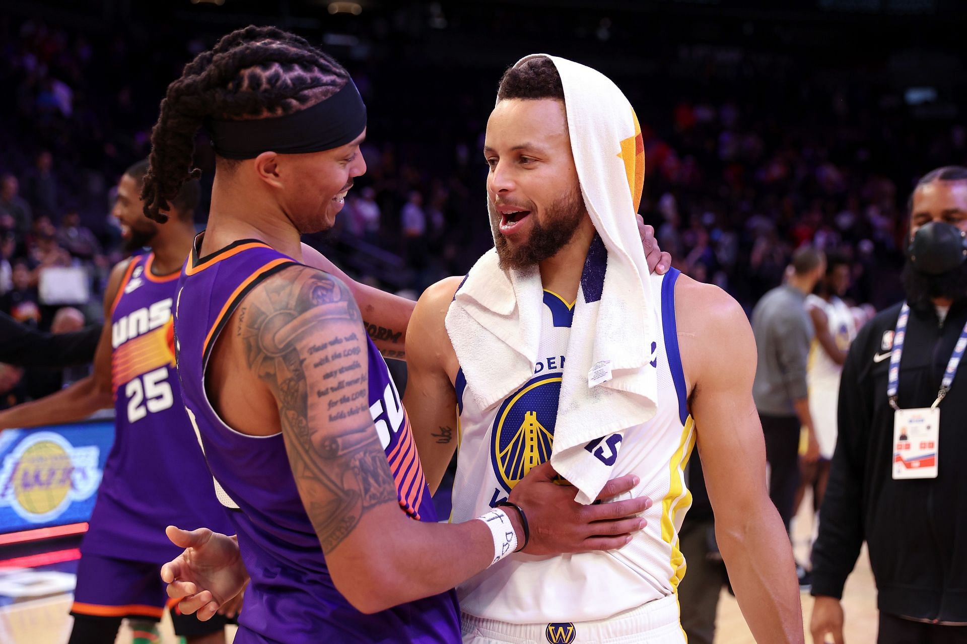 Stephen Curry and Damion Lee embracing each other after a game between the Phoenix Suns and the Golden State Warriors - Source: Getty