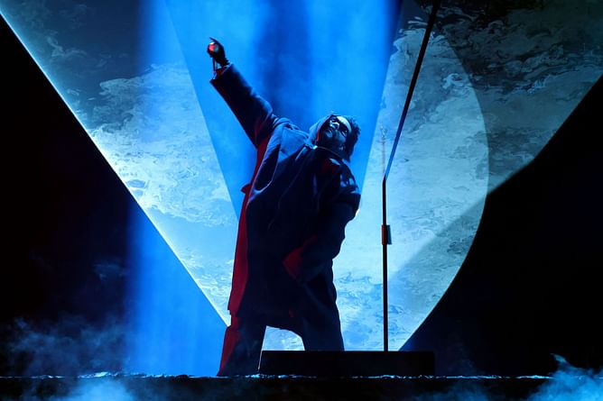 What happened between The Weeknd and the Grammys? Singer is revealed as the highly anticipated 'surprise surperstar performer' at the event