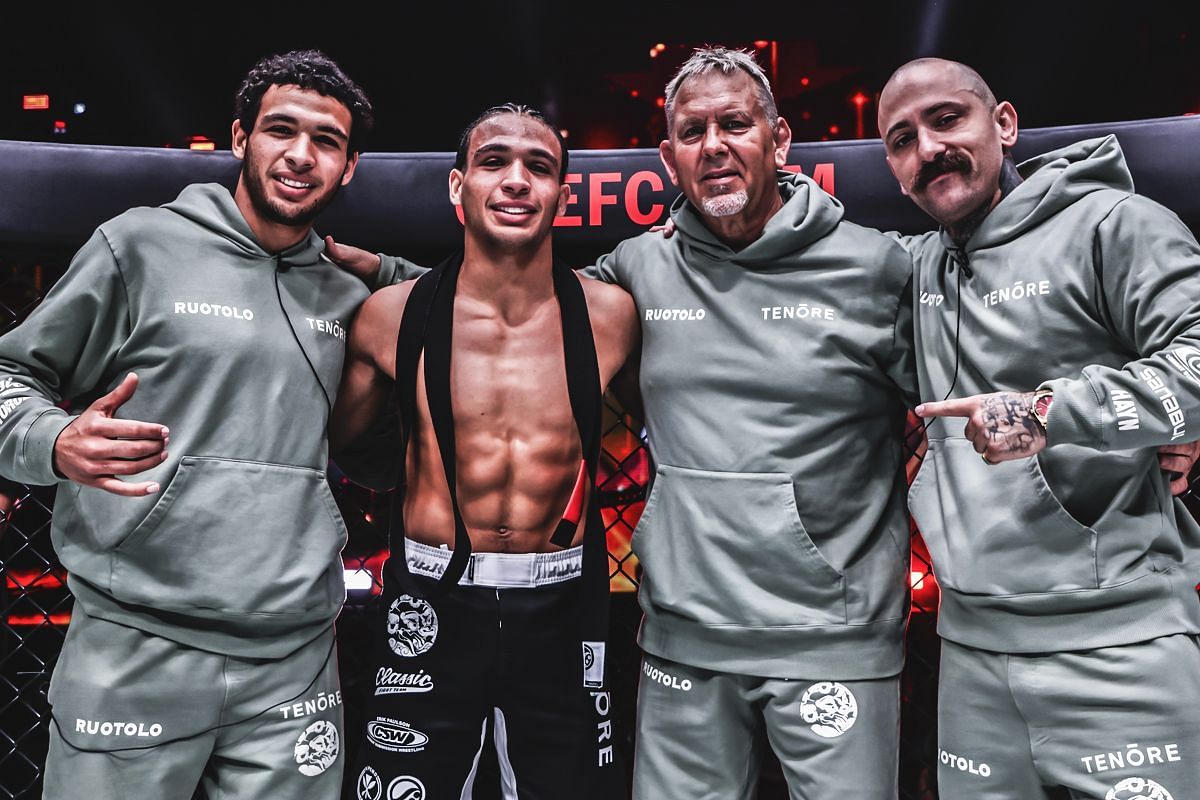 Tye and Kade Ruotolo (from left) pose with their coaches [Photo via ONE Championship]