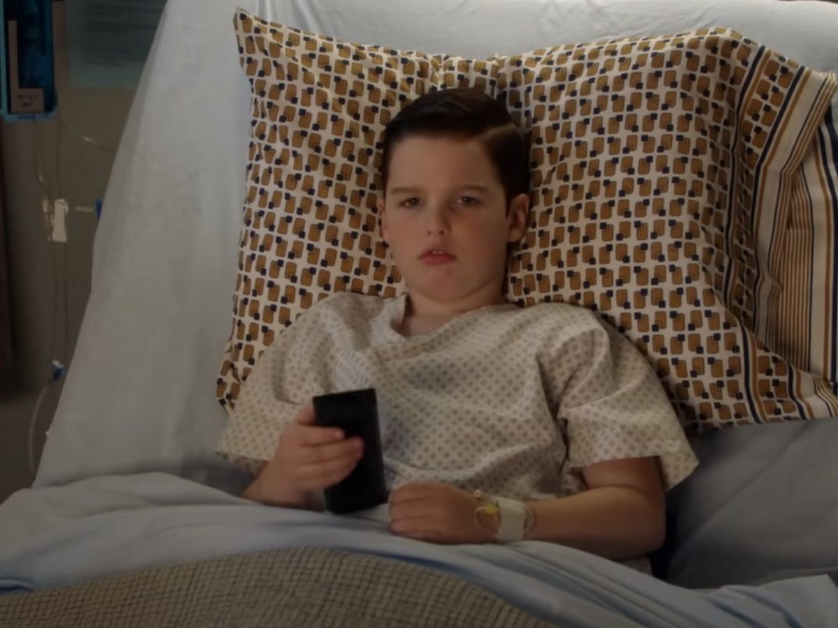 Sheldon lying down in a hospital bed (Image via YouTube/TBS)