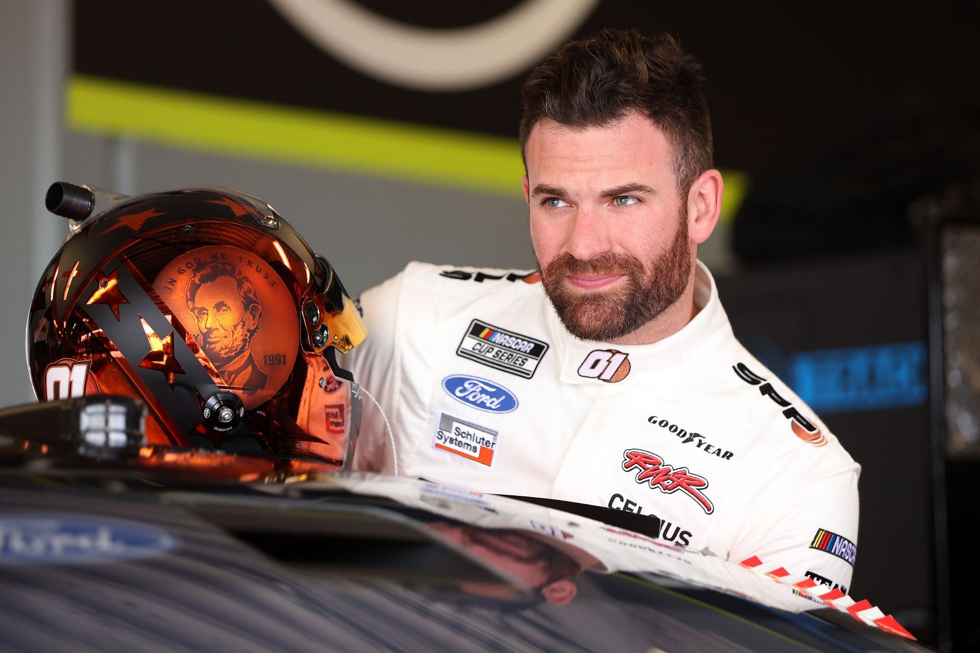 Corey LaJoie enters his car in the garage area during practice for the NASCAR Cup Series Daytona 500 (February 15, 2025  - Source: Getty)