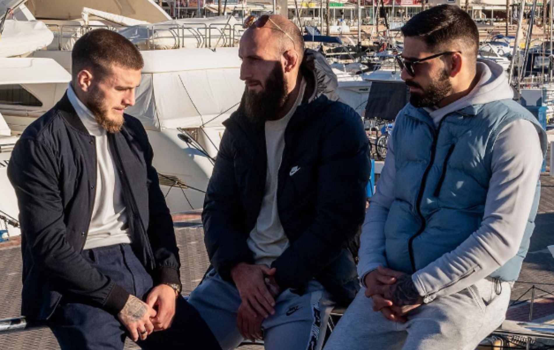 Aleksandre Topuria (left) discusses MMA return with coach Guram Kutateladze (center) and Ilia Topuria (right). [Image Courtesy: @aleksandre_topuria on Instagram]