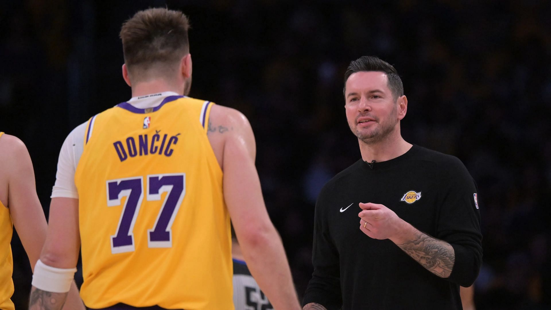 Lakers fans react to JJ Redick seemingly cheesing after seeing Luka Doncic on his bench. (Photo: IMAGN)