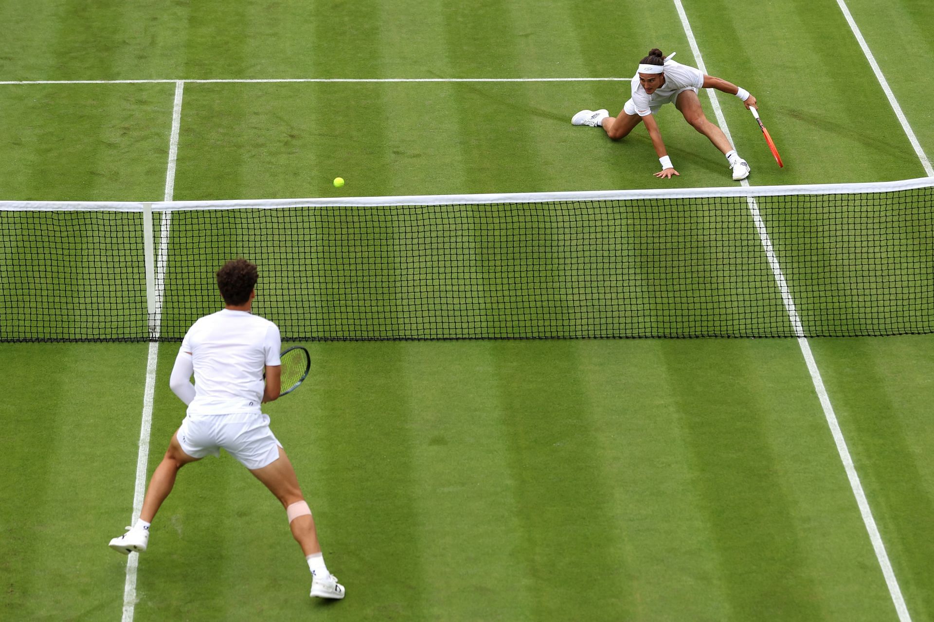 Bellucci (far right) pictured against Ben Shelton at Wimbledon 2024 - Image Source: Getty