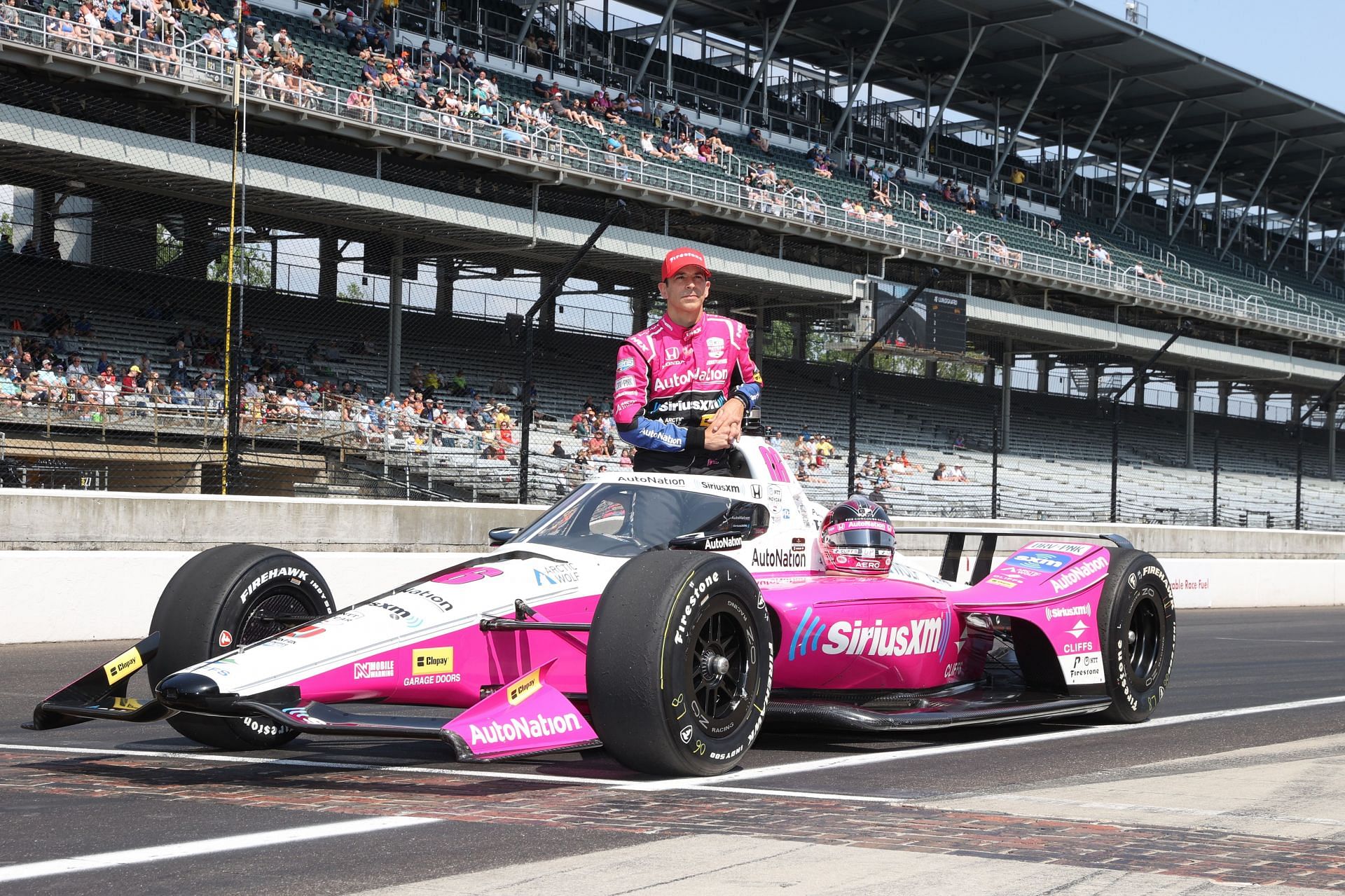 INDIANAPOLIS, IN - MAY 20: NTT IndyCar series driver Helio Castroneves (06) poses for his official photo at the yard of bricks after qualifying for the 107th running of the Indianapolis 500 on May 20, 2023, at the Indianapolis Motor Speedway in Indianapolis, Indiana. (Photo by Brian Spurlock/Icon Sportswire via Getty Images) - Source: Getty