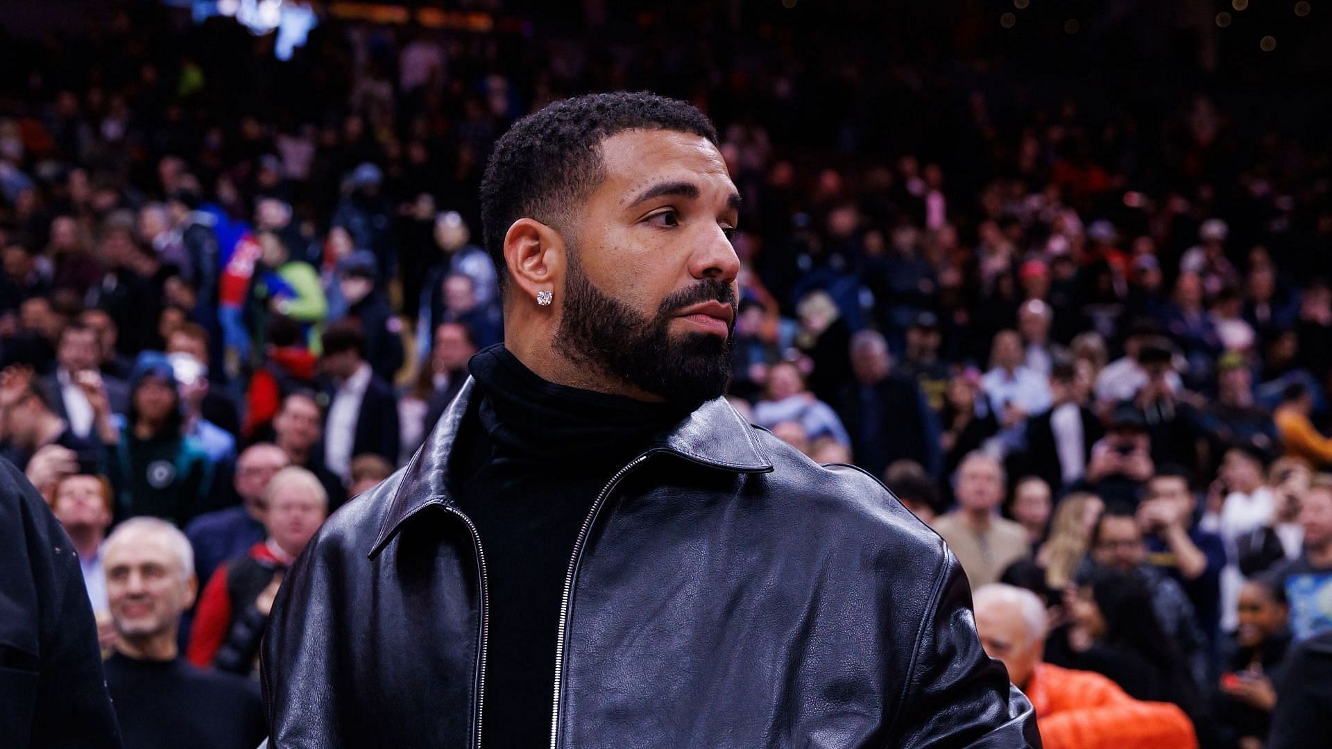 Rapper Drake leaves the court following the NBA game between the Toronto Raptors and the Golden State Warriors at Scotiabank Arena on January 13, 2025, in Toronto, Canada. (Image via Getty/Cole Burston)