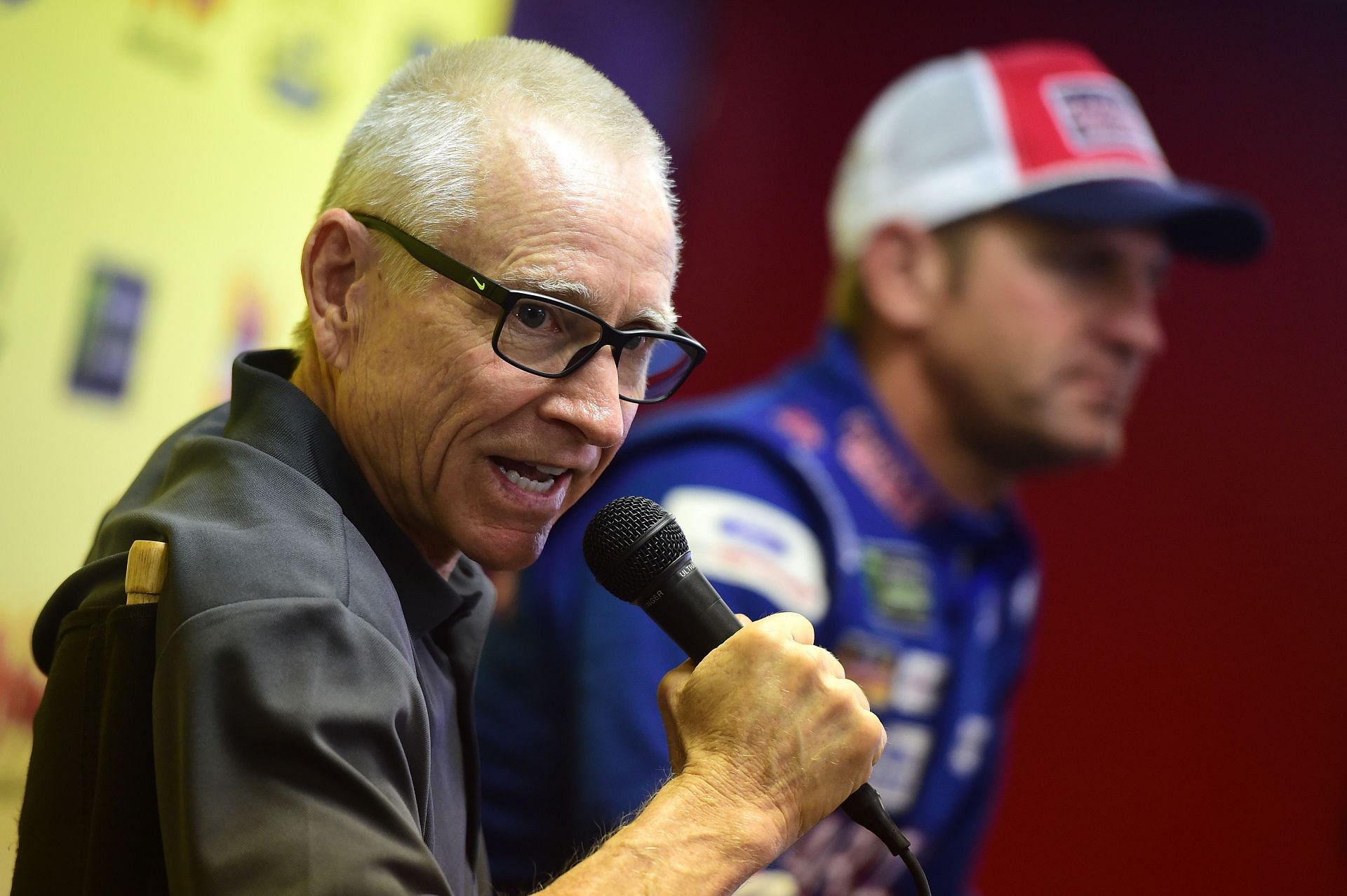 DARLINGTON, SC - SEPTEMBER 01:  NASCAR Hall of Famer Mark Martin (L) speaks with the media as Clint Bowyer, driver of the #14 Carolina Ford Dealers Ford, looks on during a press conference prior to practice for the Monster Energy NASCAR Cup Series Bojangles