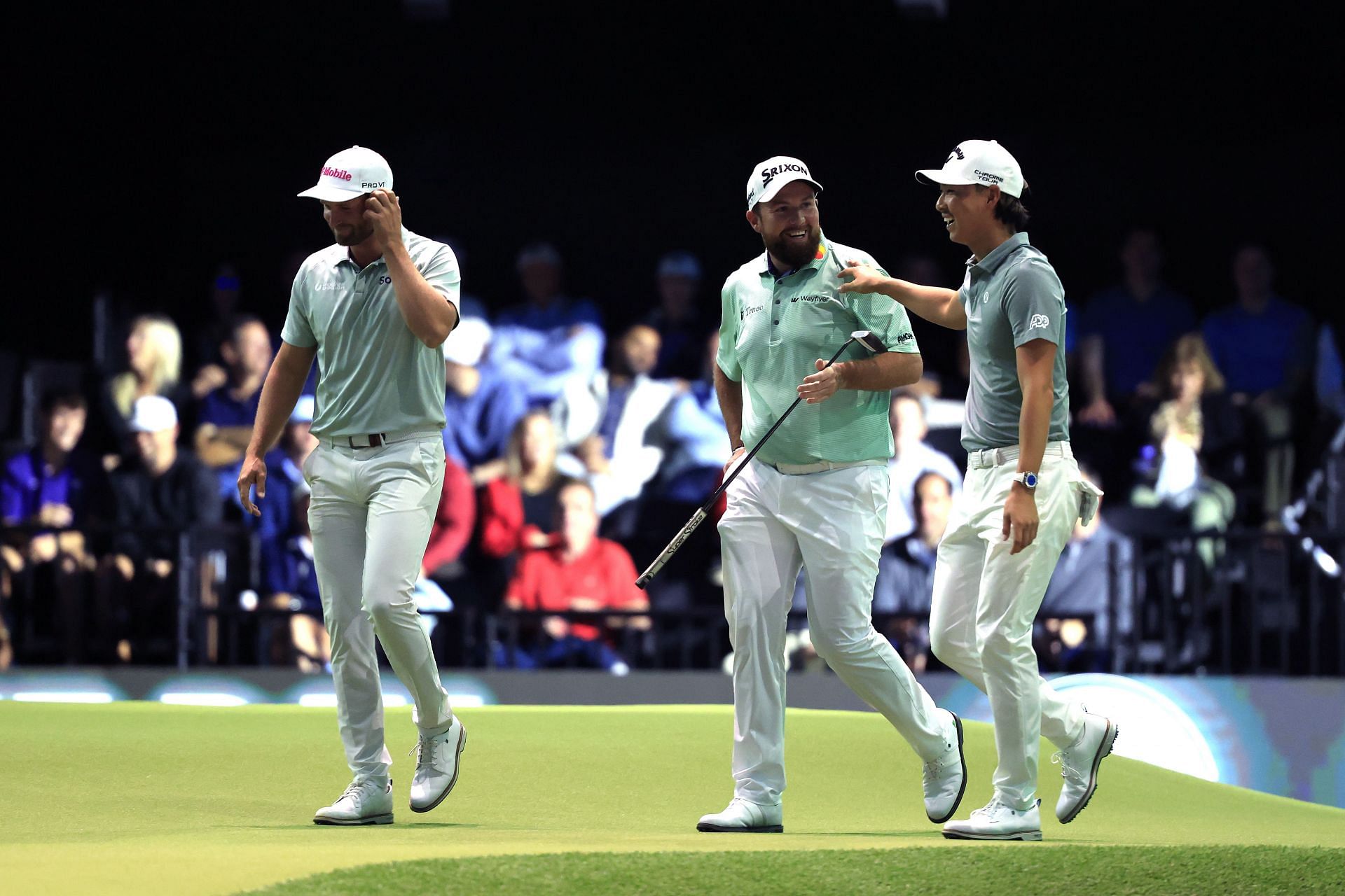 Wyndham Clark, Shane Lowry, and Min Woo Lee of The Bay Golf Club celebrate on the ninth green during their TGL match against the Jupiter Links Golf Club - Source: Getty