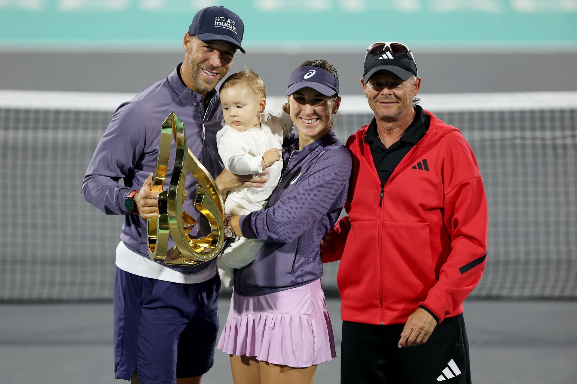 Belinda Bencic pictured with husband Martin Hromkovic and daughter Bella at the 2025 Abu Dhabi Open | Image Source: Getty