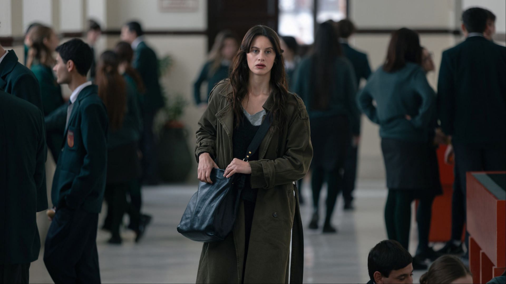 Miren Rojo (Milena Smit) investigates a lead in her relentless pursuit of answers in The Snow Girl season 2 (Image via Julio Vergne/Netflix Tudum)