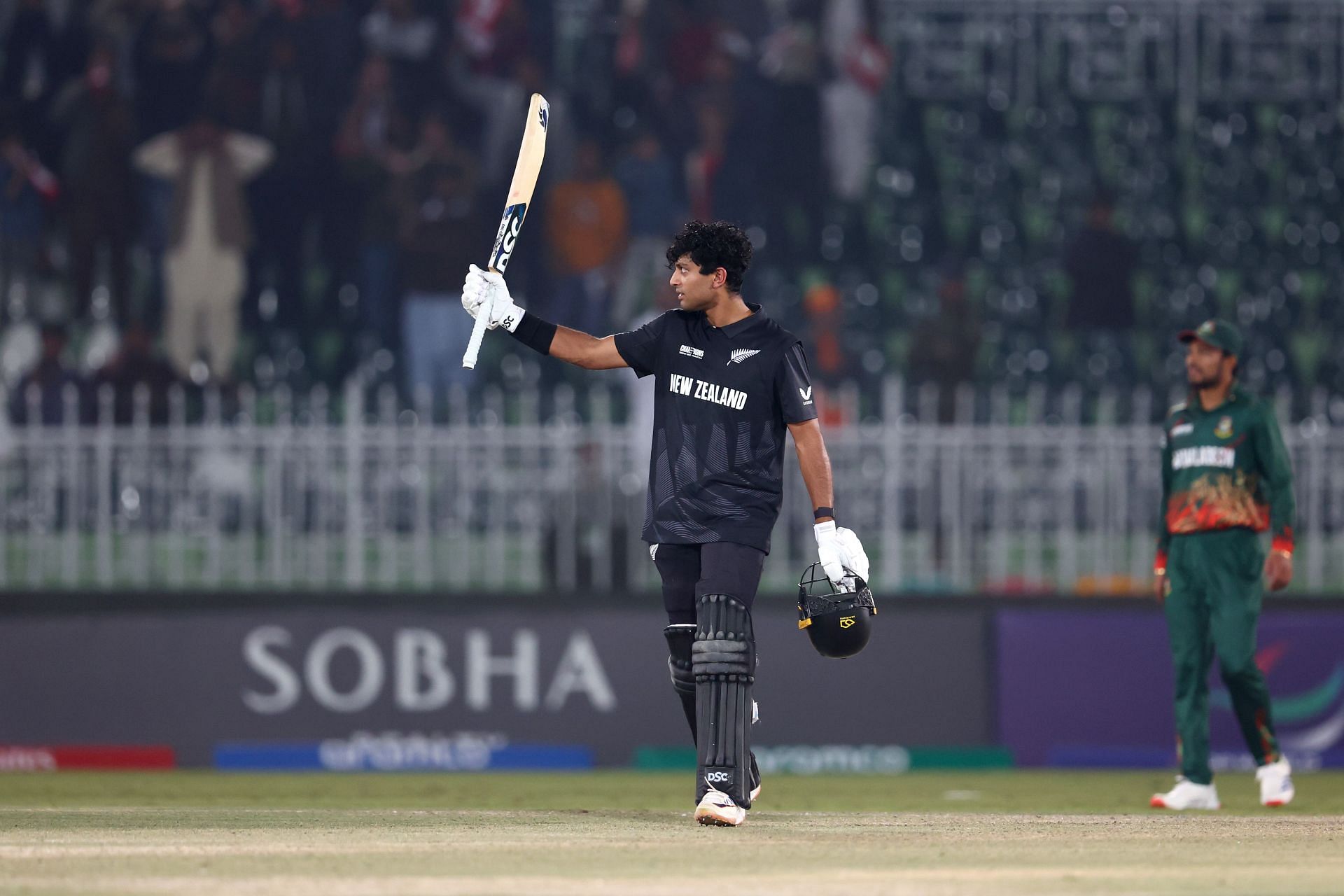 Fan runs onto the field with a photograph and hugs Rachin Ravindra during BAN vs NZ 2025 Champions Trophy match [Watch]