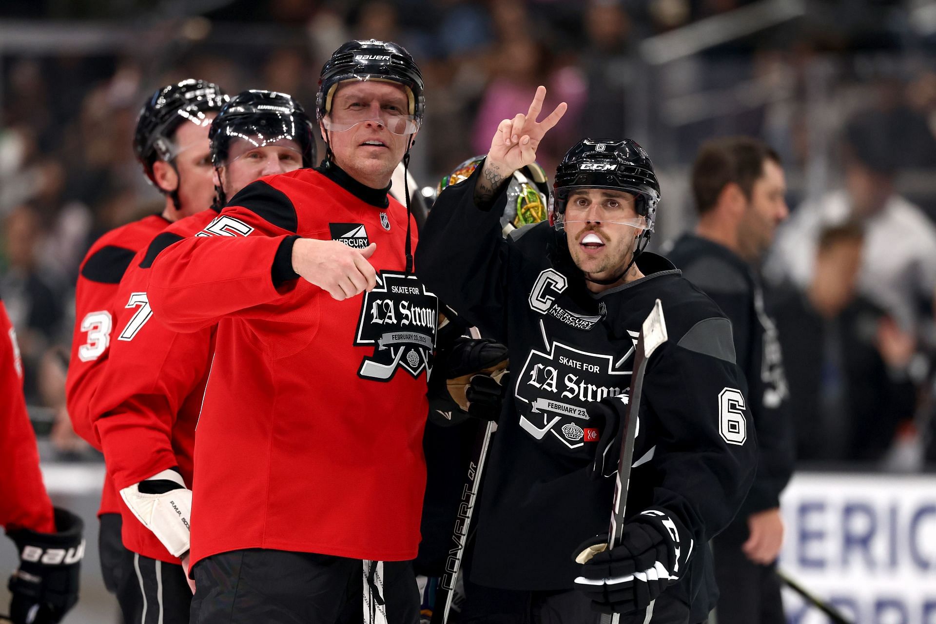 Dany Heatley #15 of Team Red and Justin Bieber #6 of Team Black during the Skate For LA Strong event at Crypto.com Arena in Los Angeles, California. (Photo by Katelyn Mulcahy/Getty Images)