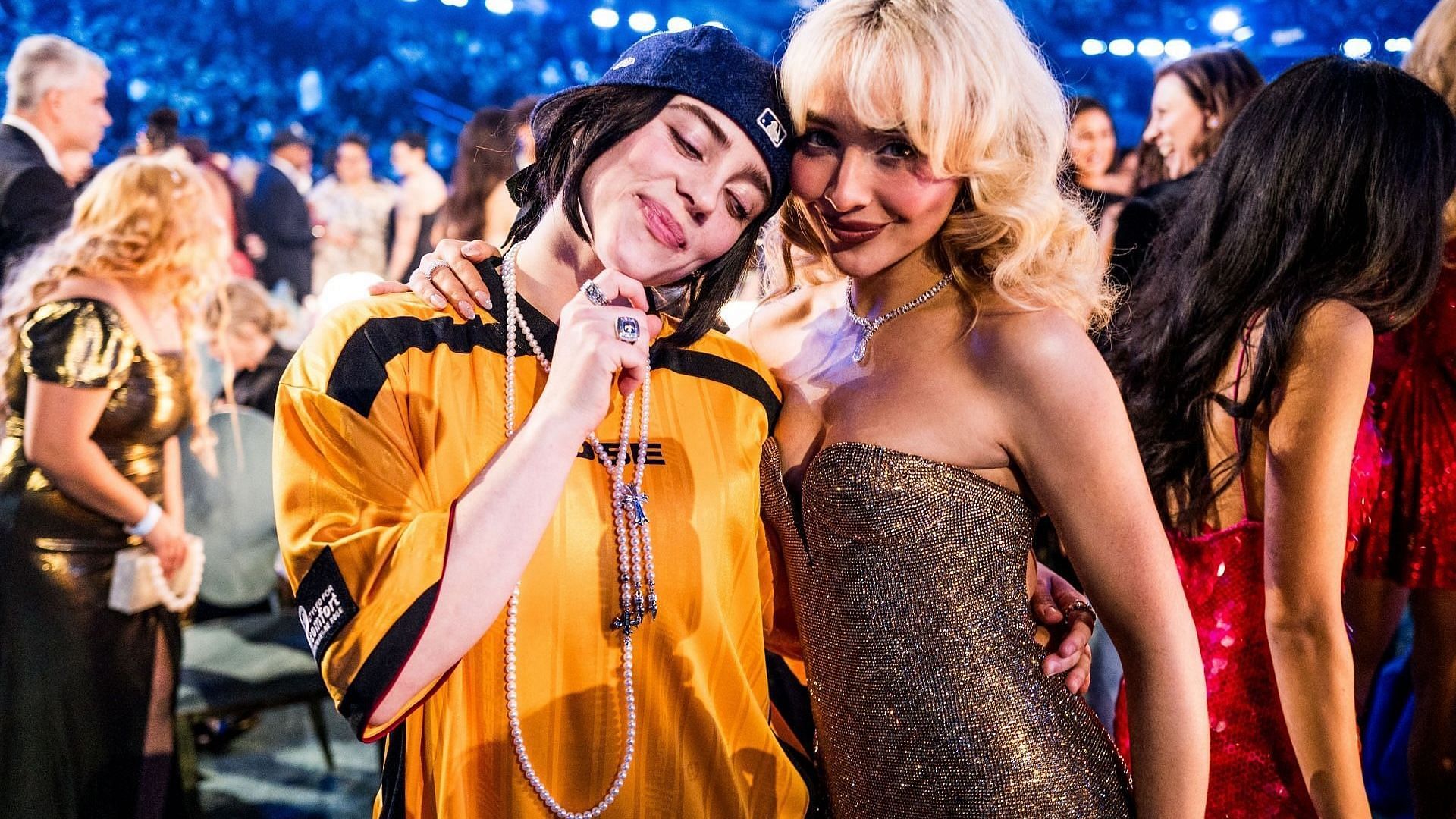 (L-R) Billie Eilish and Sabrina Carpenter attend the 67th Annual GRAMMY Awards at Crypto.com Arena on February 02, 2025, in Los Angeles, California. (Image via Getty/John Shearer)