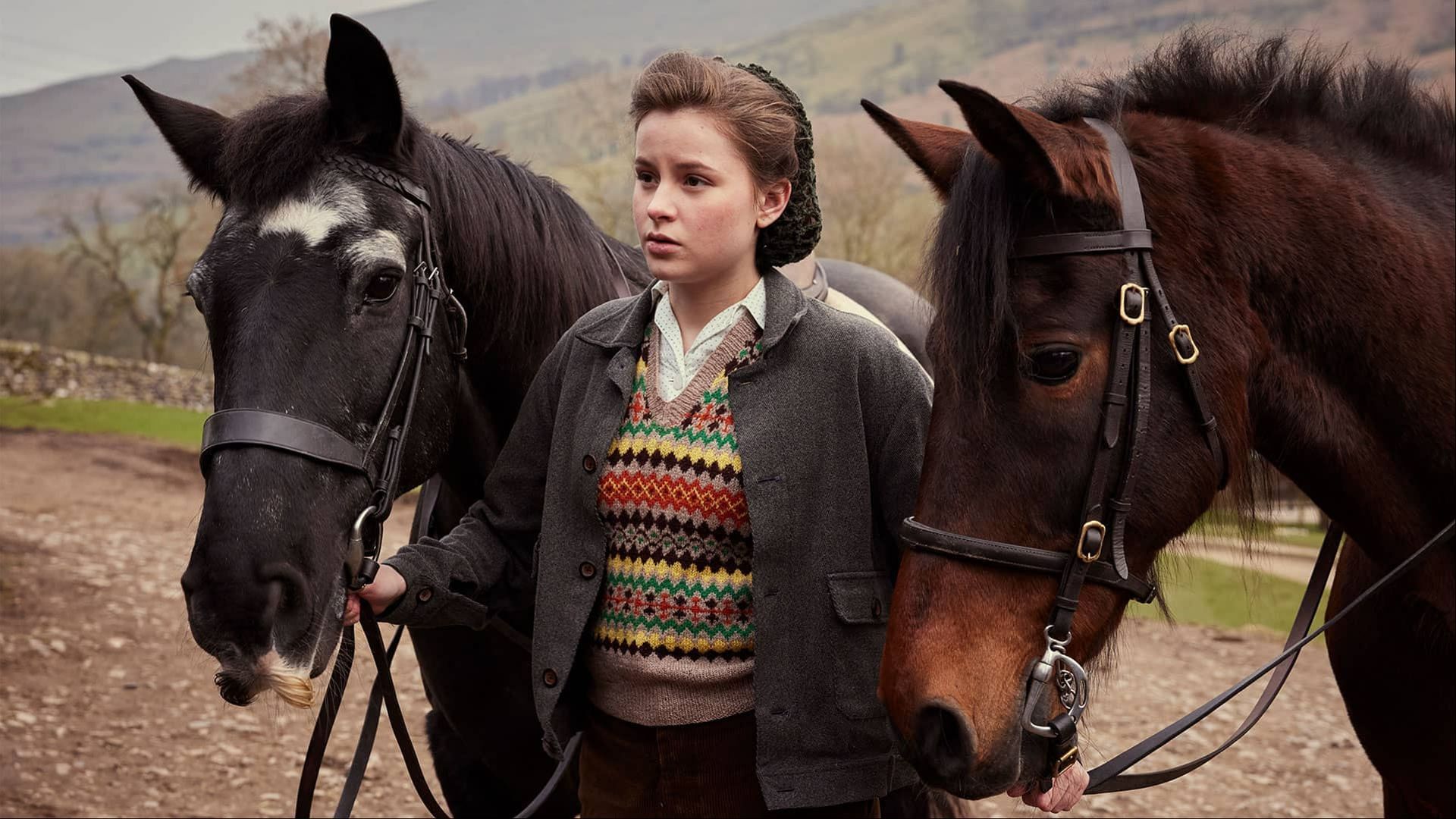 Imogen Clawson as Jenny Alderson handling horses, reflecting the challenges and responsibilities of rural life in Yorkshire in All Creatures Great and Small. (Image via PBS)