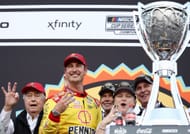 Joey Logano, driver of the #22 Shell Pennzoil Ford, and Team Penske owner, Roger Penske celebrate in victory lane after winning the NASCAR Cup Series Championship - Source: Getty
