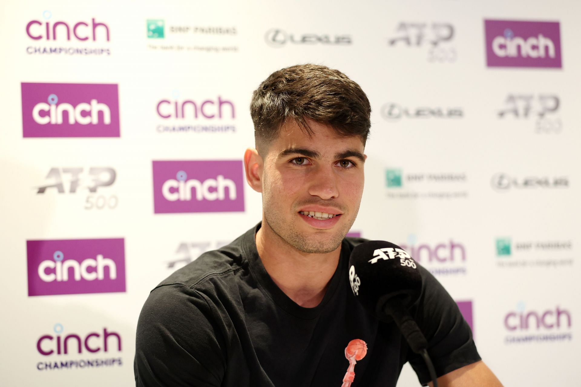 Carlos Alcaraz pictured speaking at a press conference [Image Source: Getty Images]