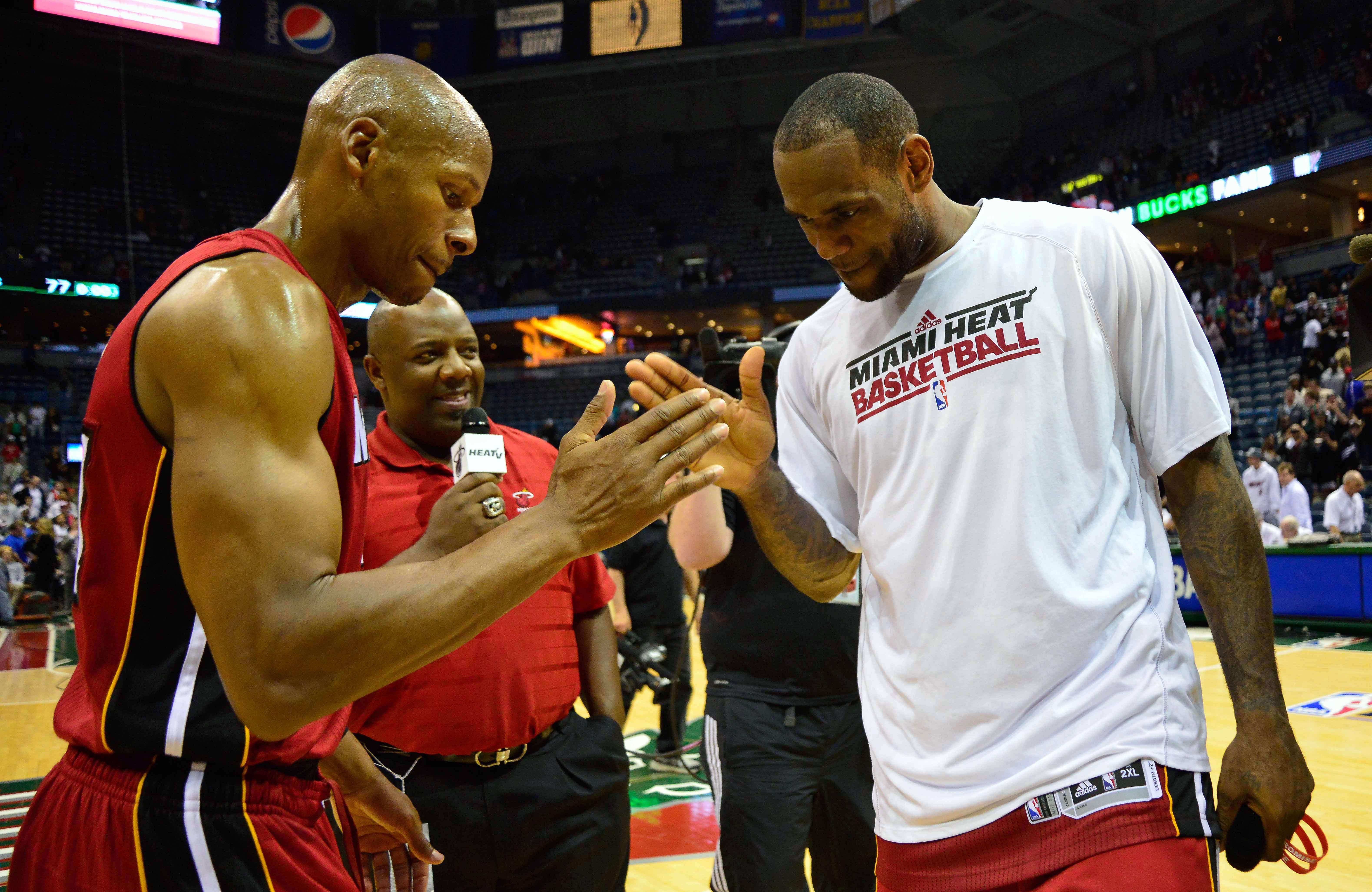 Apr 28, 2013; Milwaukee, WI, USA; Miami Heat forward LeBron James (right) celebrates with guard Ray Allen after beating the Milwaukee Bucks 88-77 in game four of the first round of the 2013 NBA playoffs at the BMO Harris Bradley Center. Mandatory Credit: Benny Sieu-Imagn Images - Source: Imagn