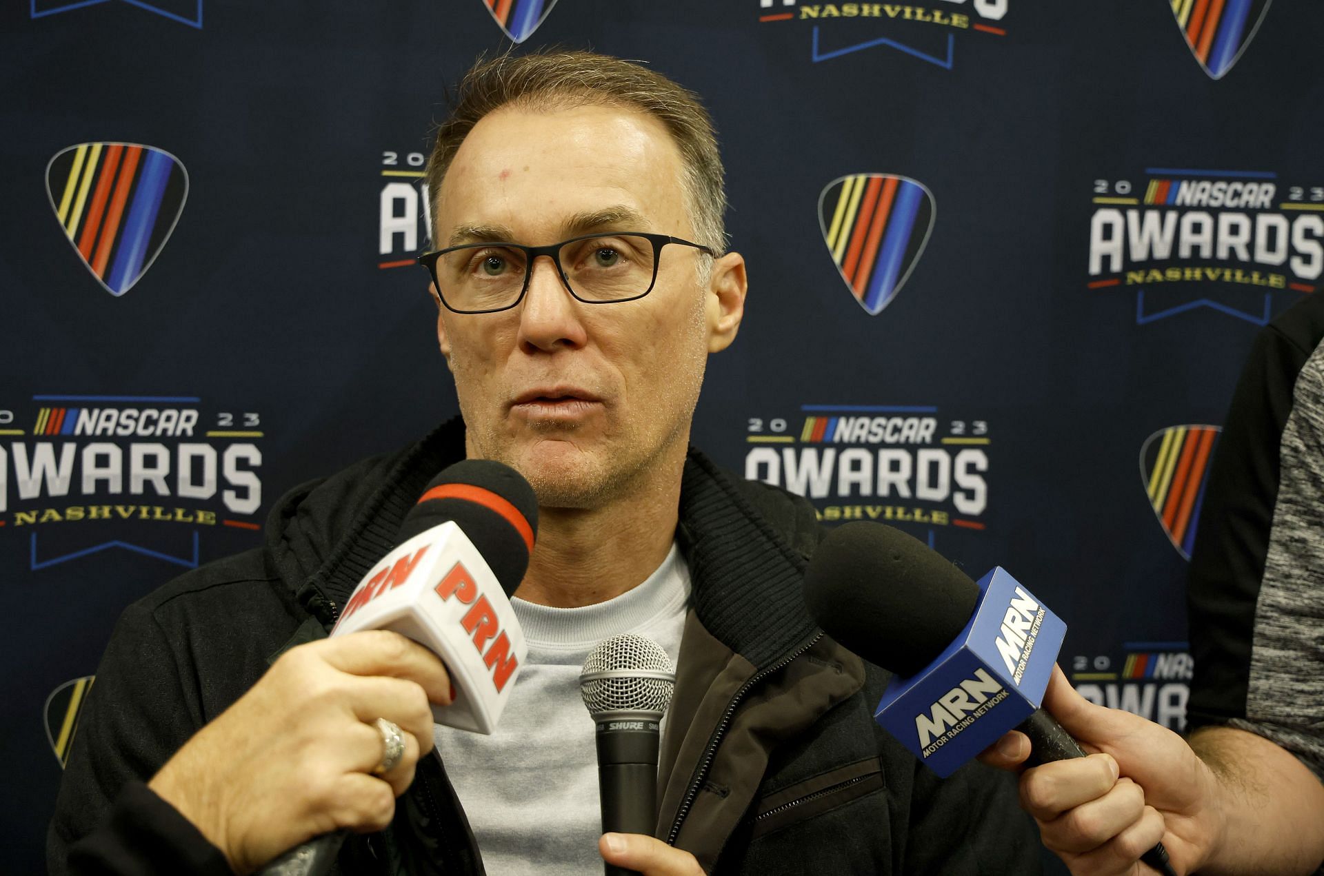 NASHVILLE, TENNESSEE - NOVEMBER 30: Retired NASCAR Cup Series driver, Kevin Harvick speaks to the media during the media scrum at Music City Center on November 30, 2023 in Nashville, Tennessee. (Photo by Chris Graythen/Getty Images) - Source: Getty