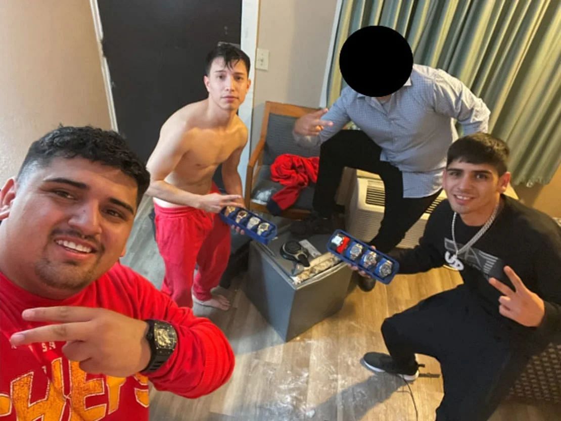 Alleged robbers posing with watches and jewelry - Source: Attorney&rsquo;s Office, Middle District of Florida