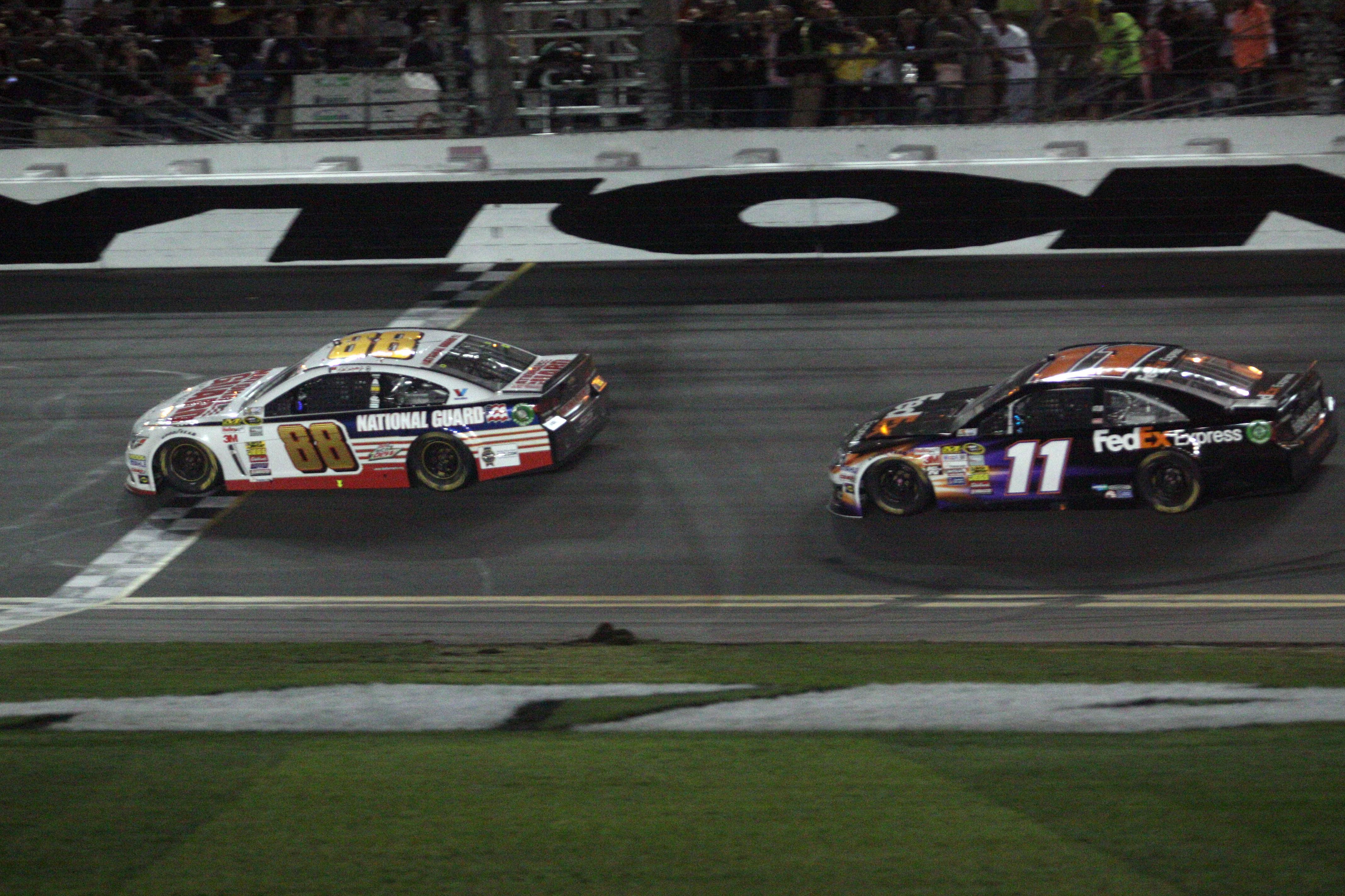 Dale Earnhardt Jr (88) beats Denny Hamlin (11) across the finish line to win the Daytona 500, Feb 23rd 2014 - Source: Imagn