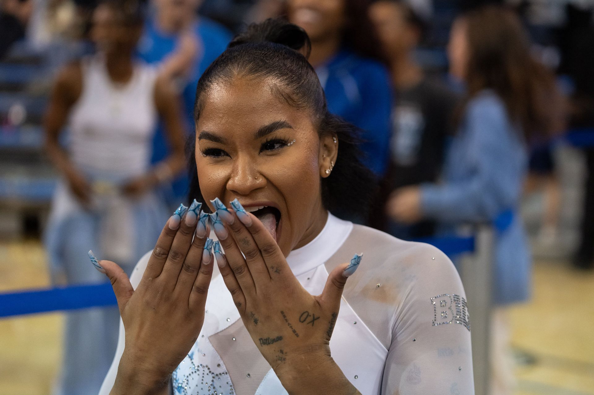 Chiles reacts to her score at the Michigan State v UCLA match-up - (Source: Getty)