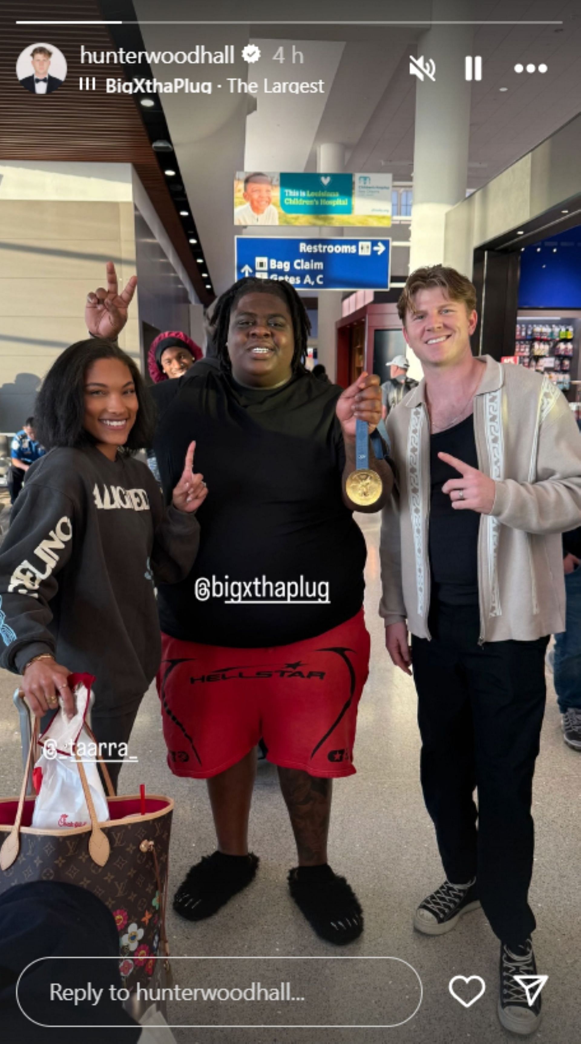 Tara Davis and her husband, Hunter Woodhall, pose with BigXthaPlug; Instagram - @hunterwoodhall