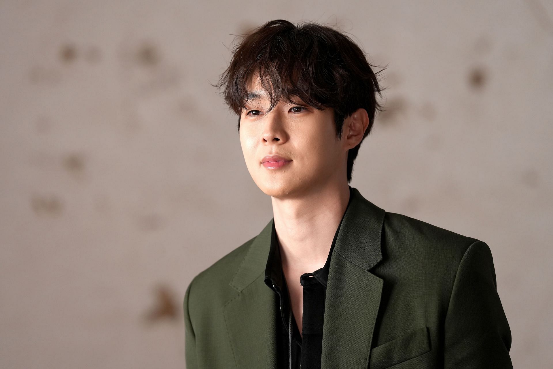 Choi Woo-shik at the Paris Fashion Week (Image via Getty)