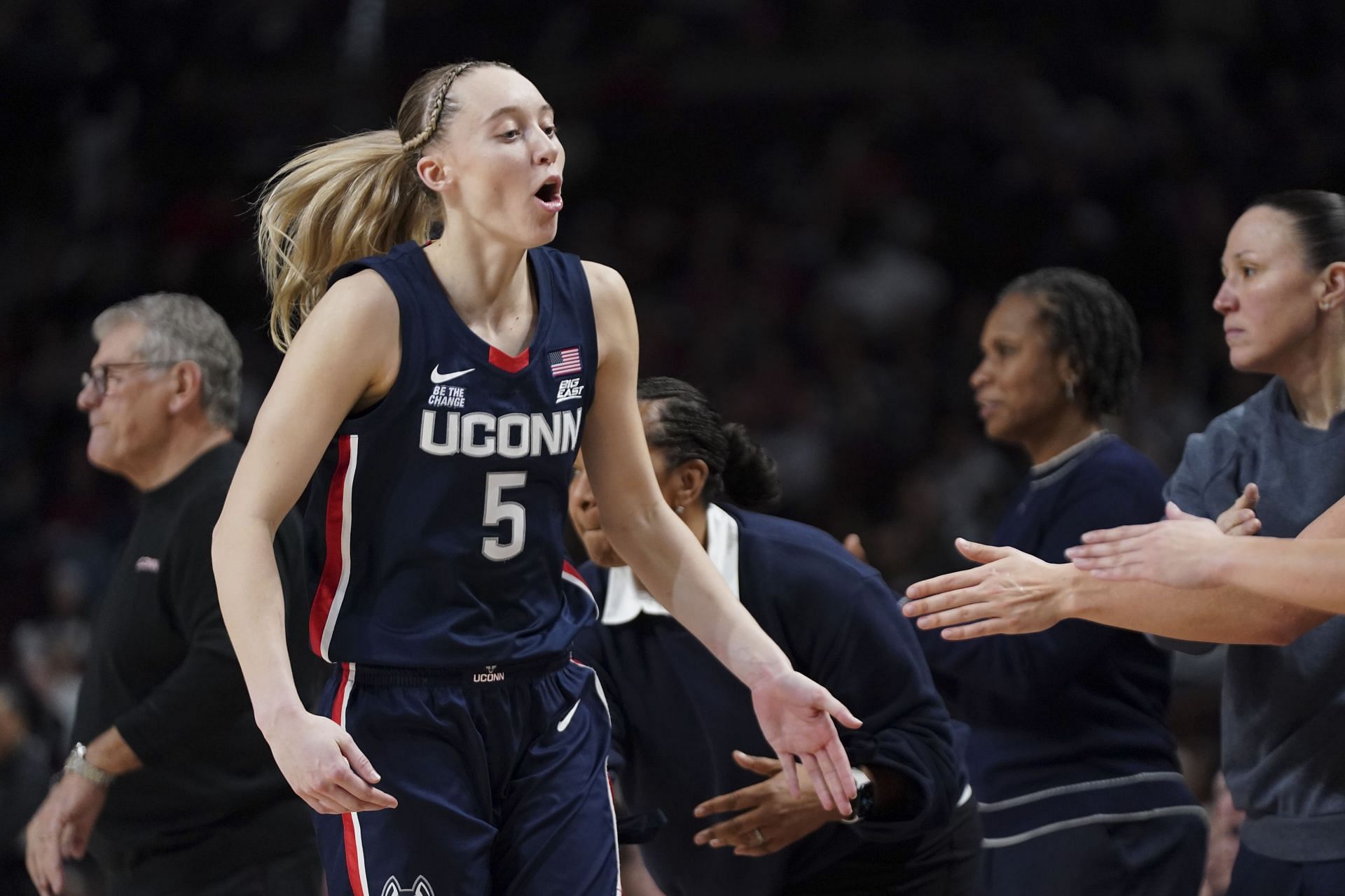 Paige Bueckers (#5) of the UConn Huskies celebrates with coach Geno Auriemma and her teammates during the fourth quarter of their NCAA women&#039;s basketball game against the South Carolina Gamecocks at Colonial Life Arena on February 16, 2025. Photo: Getty