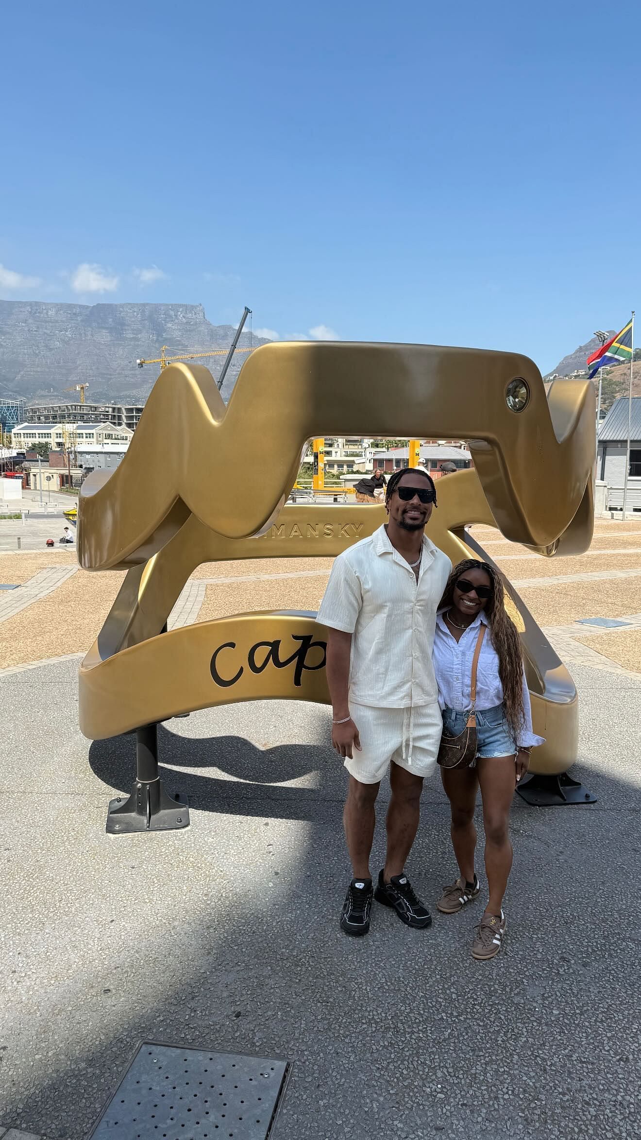 Jonathan Owens and Simone Biles pose in Cape Town, South Africa.