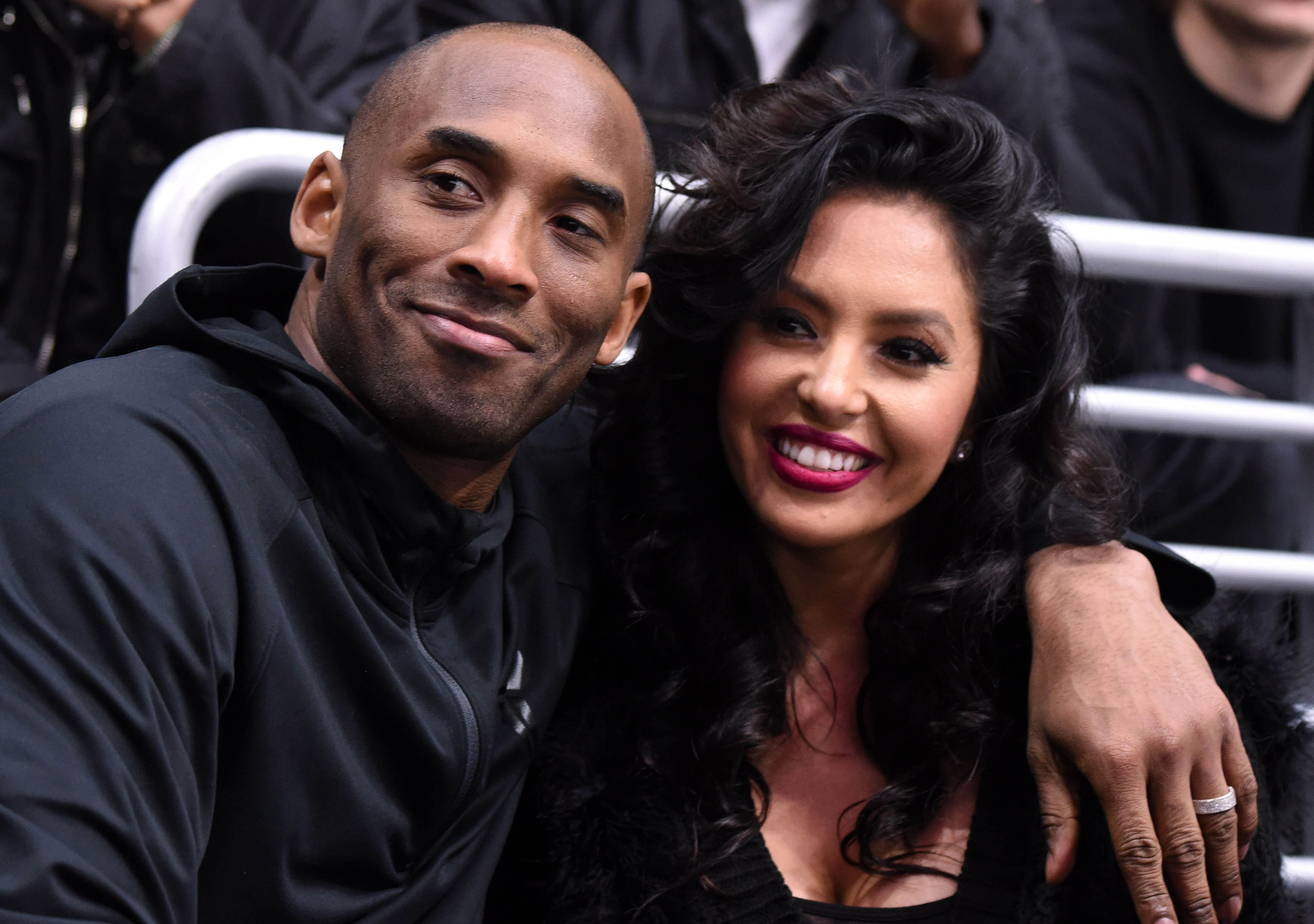 Mar 9, 2016; Los Angeles, CA, USA; Los Angeles Lakers guard Kobe Bryant (left) and wife Vanessa Bryant attend an NHL game between the Washington Capitals and the Los Angeles Kings at Staples Center. Mandatory Credit: Kirby Lee-Imagn Images - Source: Imagn