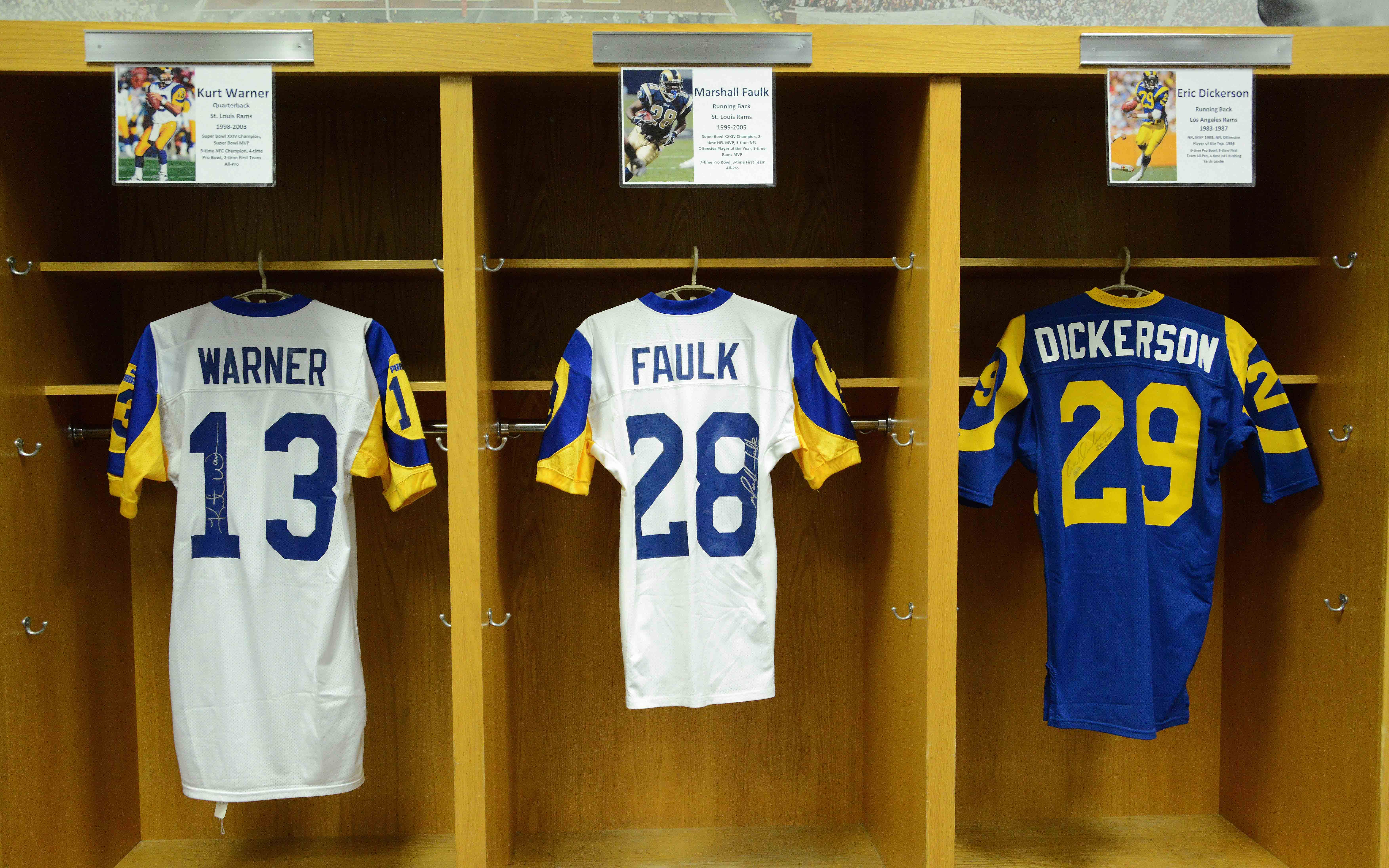 Jerseys of St. Louis Rams former quarterback Kurt Warner (13) and running back Marshall Faulk (28) and Los Angeles Rams running back Eric Dickerson (29) at NFL All-Access at the Los Angeles Memorial Coliseum. - Source: Imagn