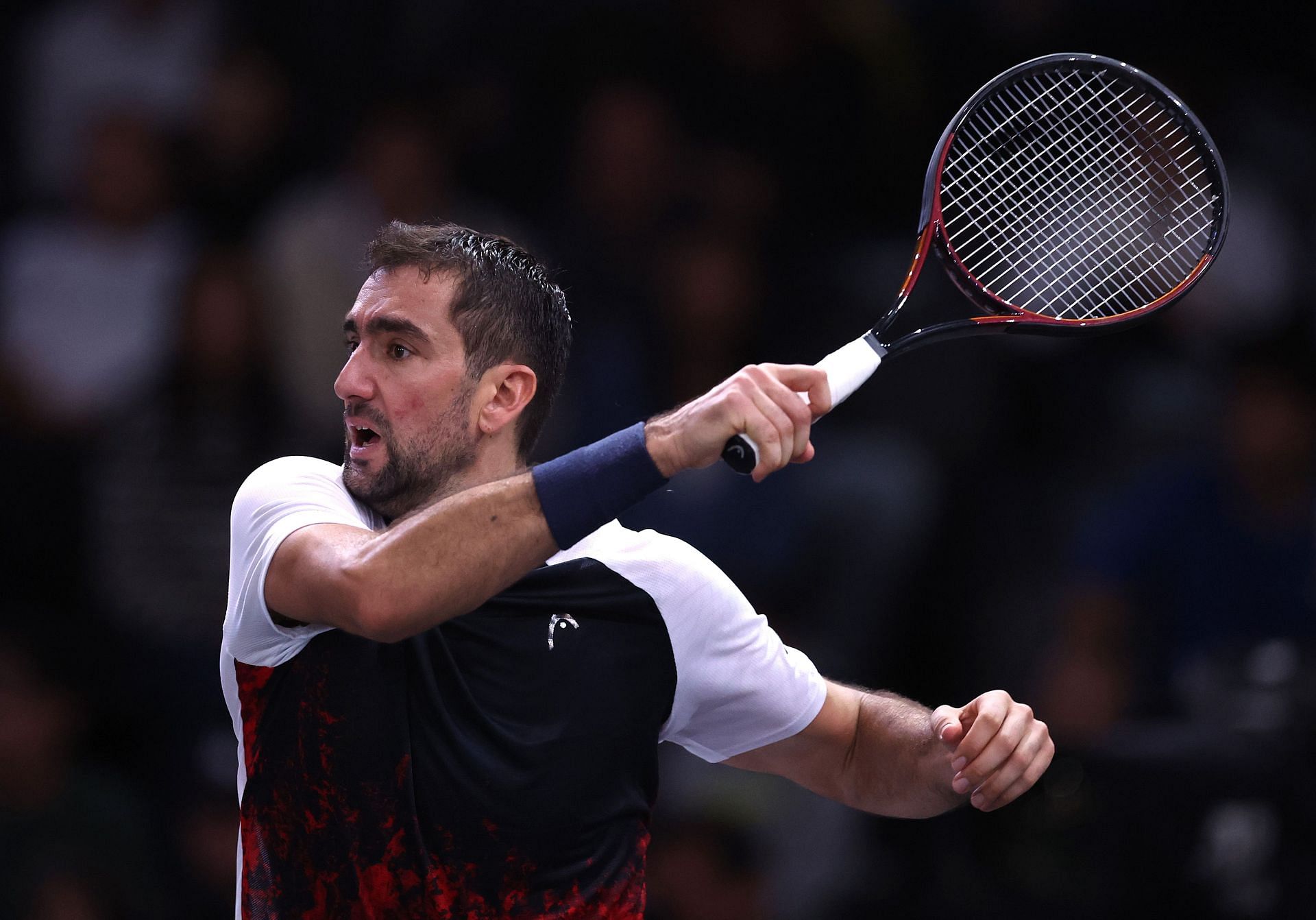 Cilic plays a forehand in the Rolex Paris Masters 2024 - Source: Getty