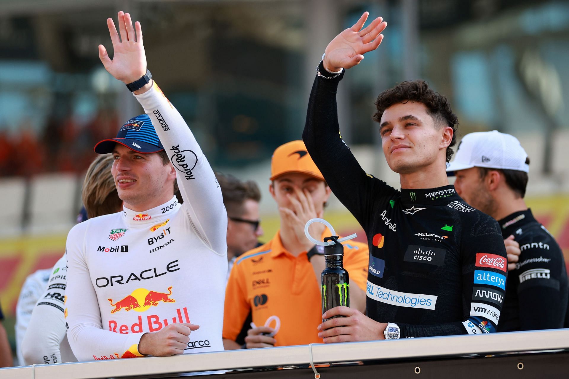 ABU DHABI, UNITED ARAB EMIRATES - DECEMBER 08: Max Verstappen of the Netherlands and Oracle Red Bull Racing and Lando Norris of Great Britain and McLaren talk on the drivers parade prior to the F1 Grand Prix of Abu Dhabi at Yas Marina Circuit on December 08, 2024 in Abu Dhabi, United Arab Emirates. (Photo by Bryn Lennon - Formula 1/Formula 1 via Getty Images) - Source: Getty