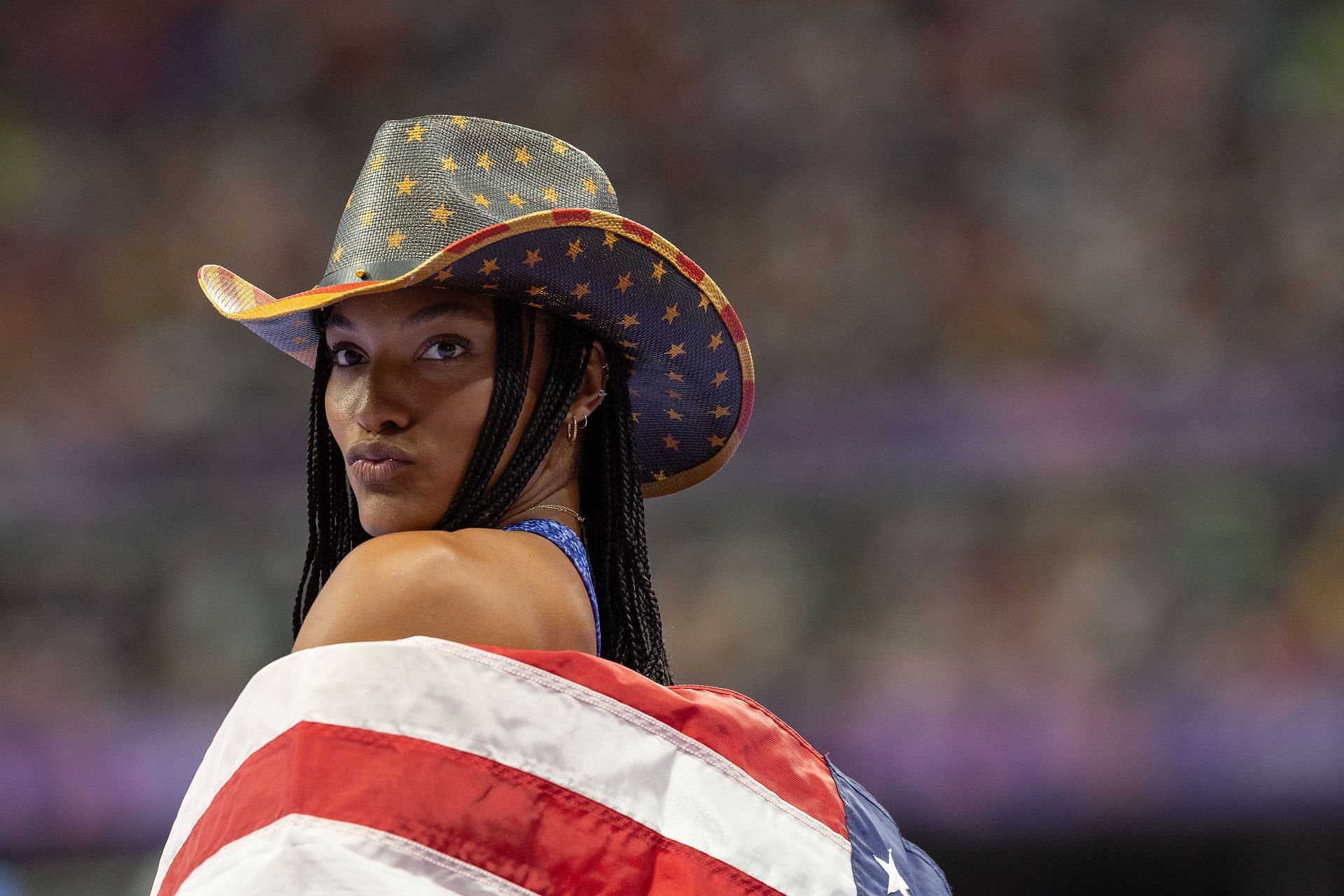 Tara Davis-Woodhall posing with the US flag at the Olympic Games Paris 2024: Day 13 - (Source: Getty)