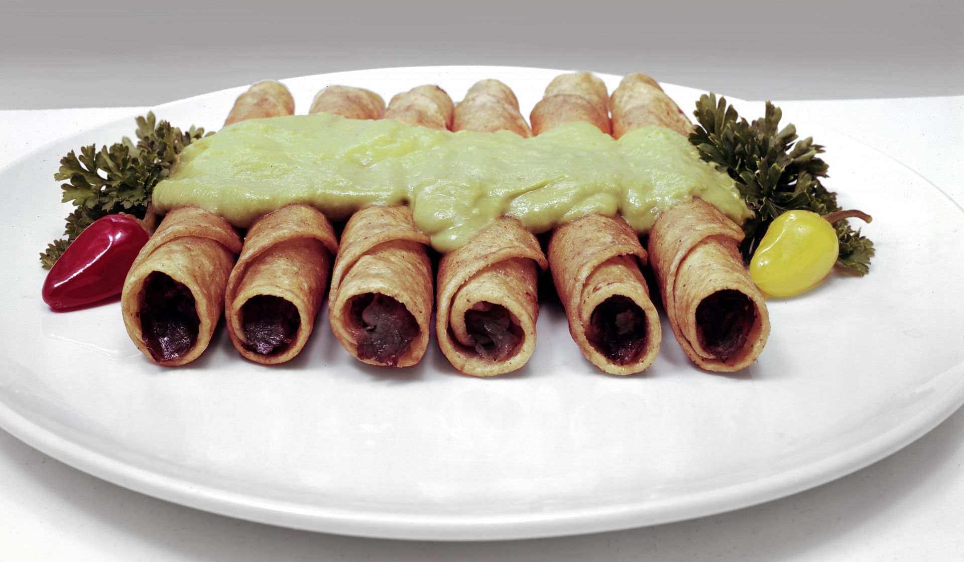 Taquitos On A Plate (Image via Getty)