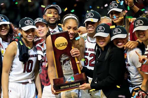 A'ja Wilson (#22) and head coach Dawn Staley of the South Carolina Gamecocks hold the NCAA trophy and celebrate with their team after winning the championship game against the Mississippi State Lady Bulldogs on April 2, 2017 in Dallas, Texas. Photo: Getty